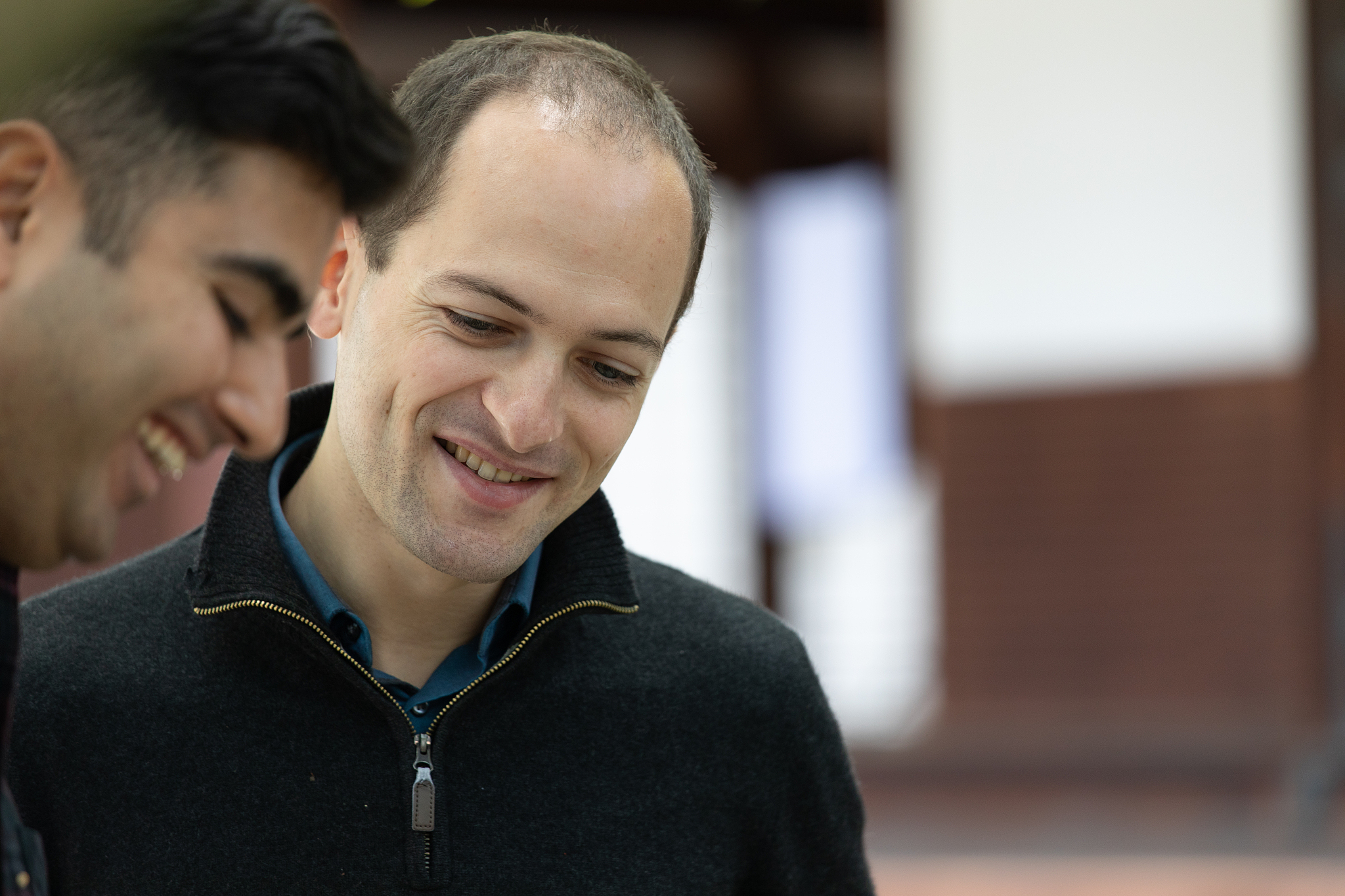 two male friends smiling at temple