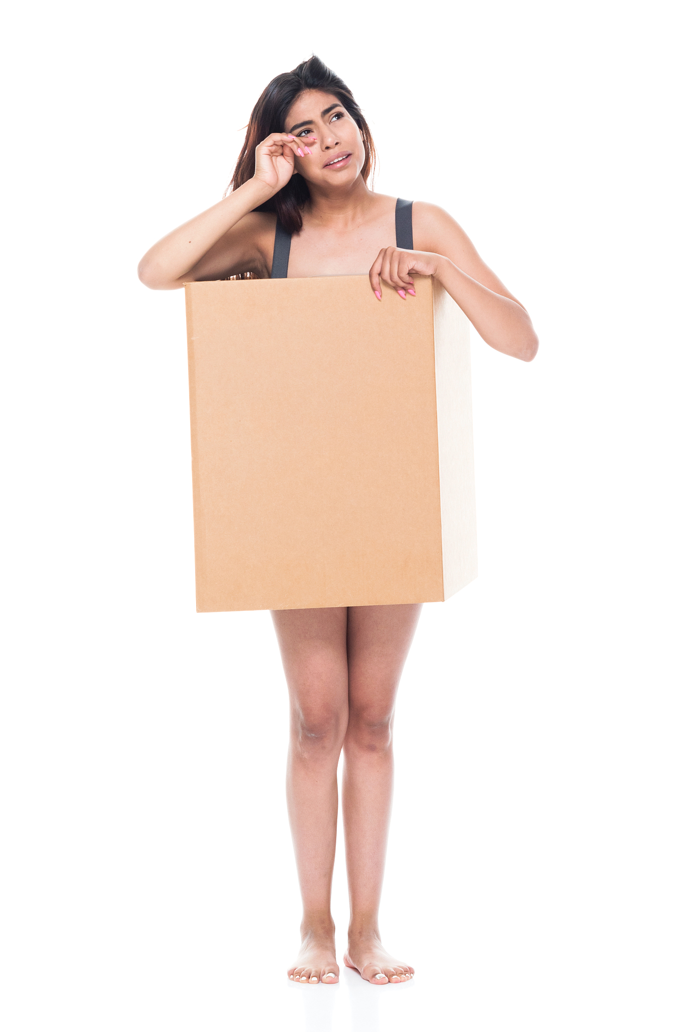 sad and depressed woman wearing a cardboard box because she is p