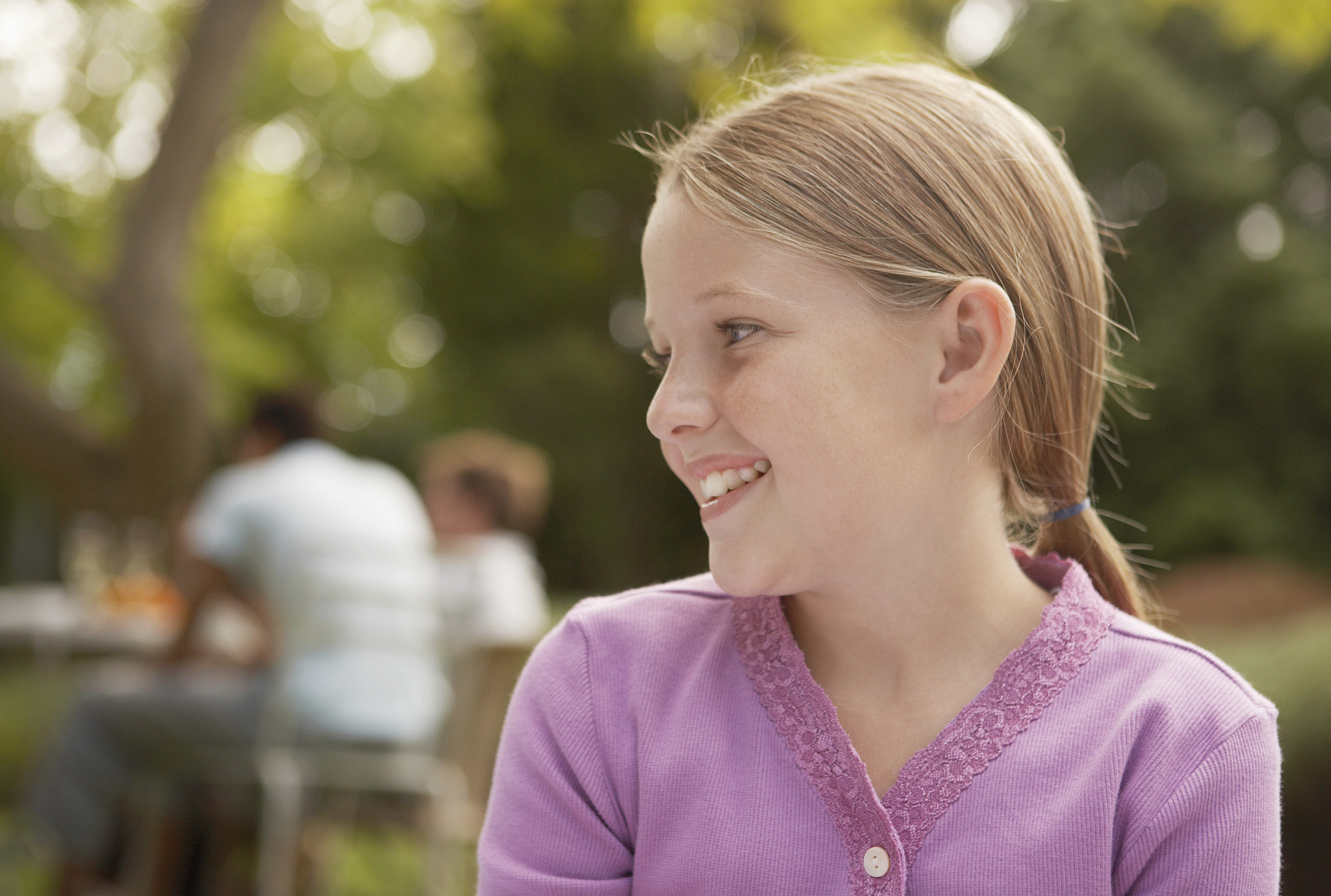 portrait of a young girl in a purple cardigan