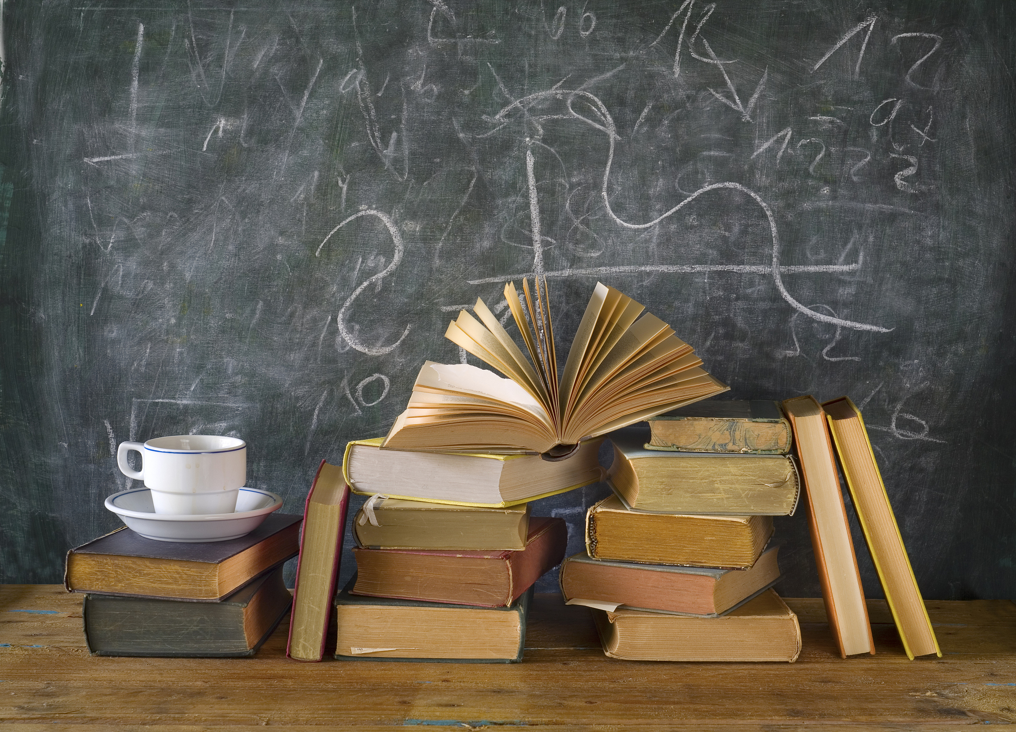 books, cup of coffee, blackboard