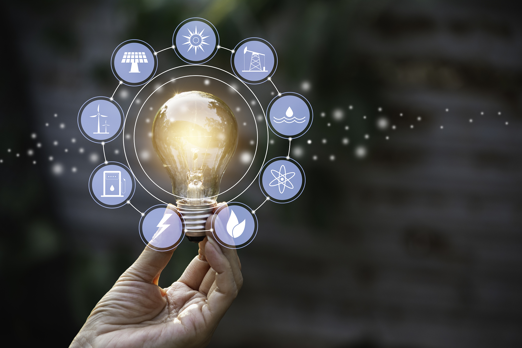 innovation and energy concept of hand hold a light bulb and copy