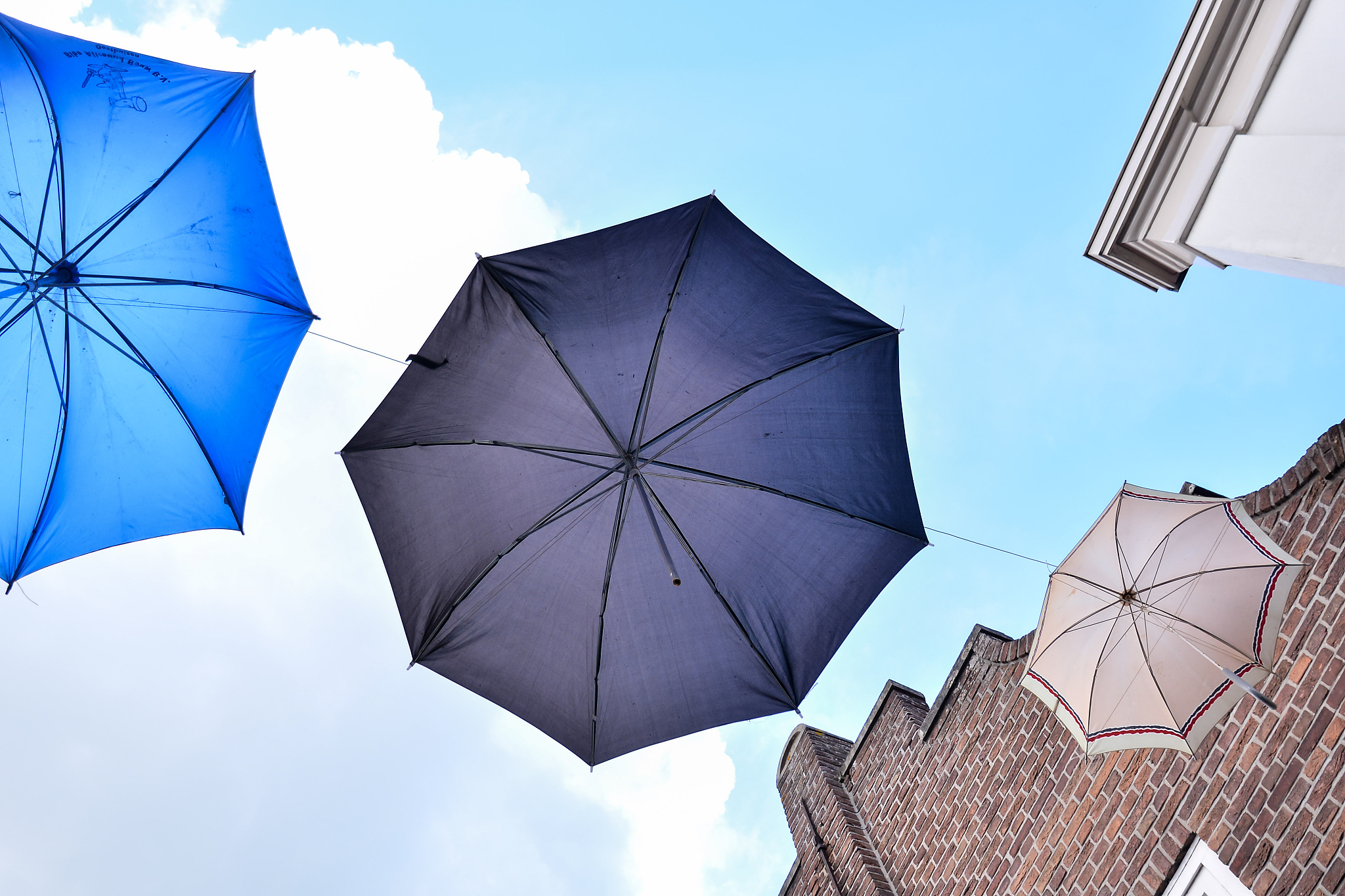 old umbrella against blue sky
