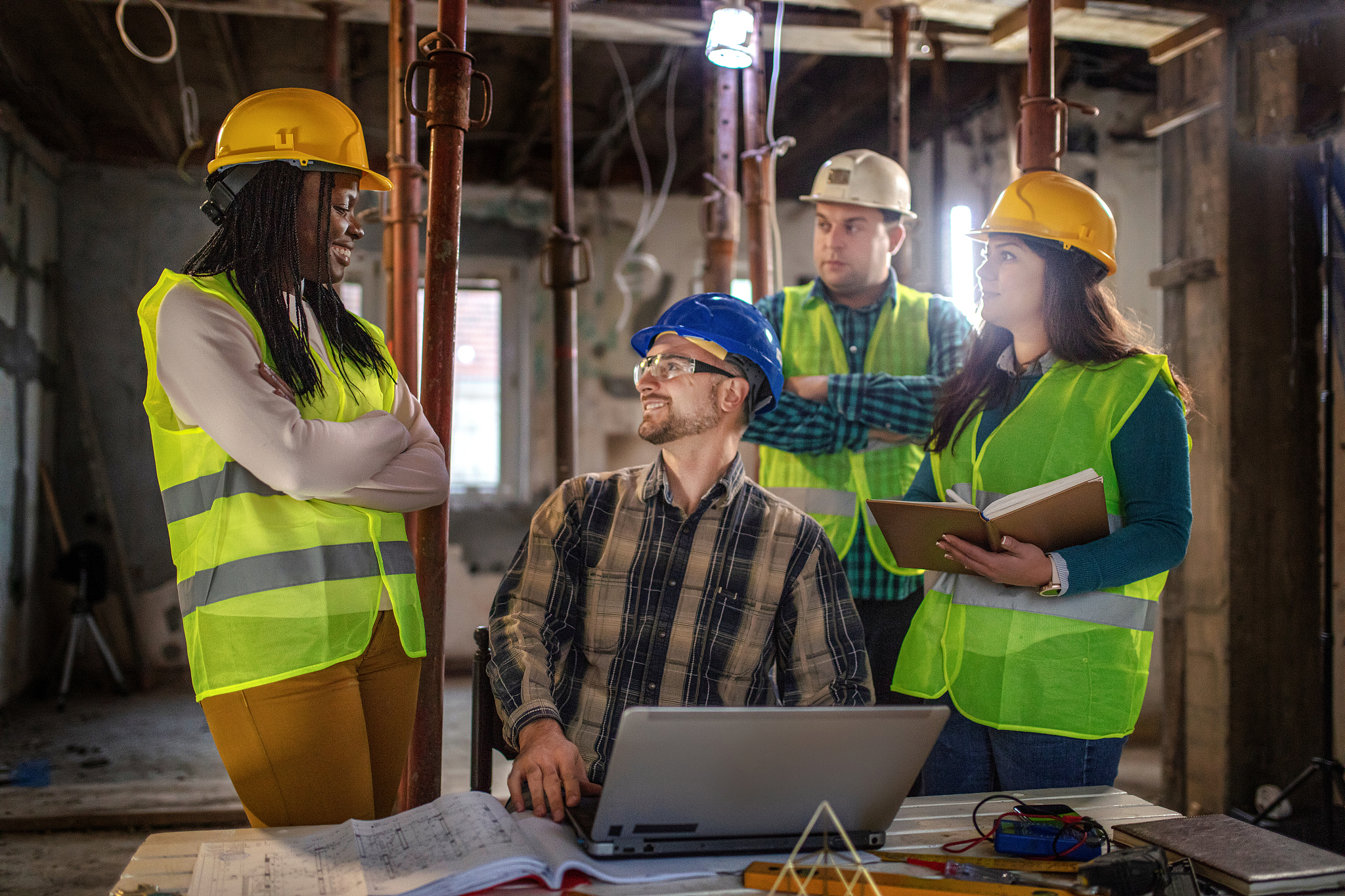 workers at construction job site inside building