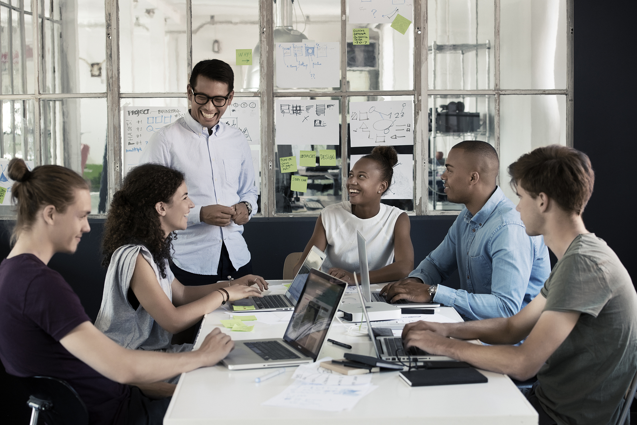 people having meeting in creative office