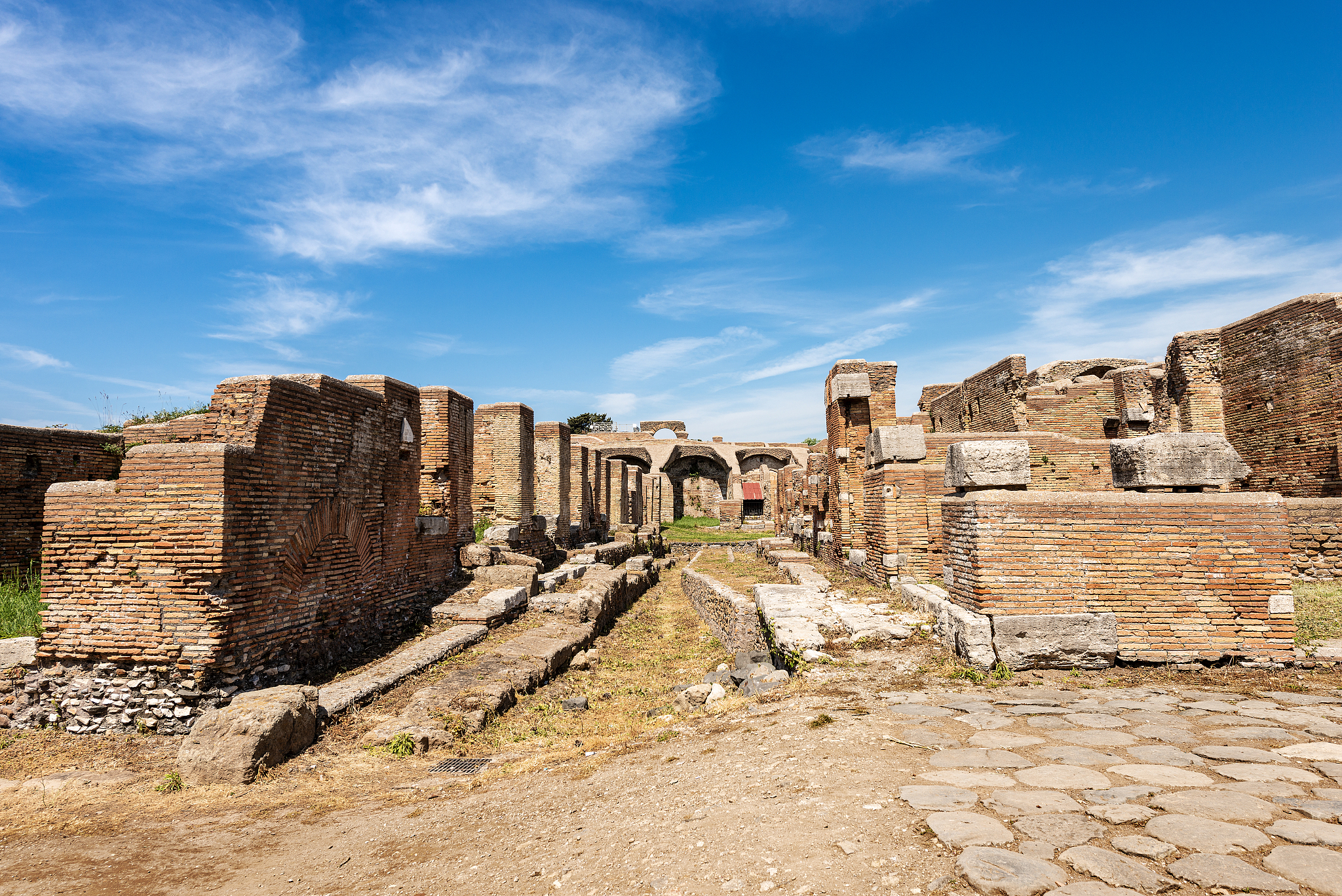 ostia antica rome italy - ancient roman buildings and road