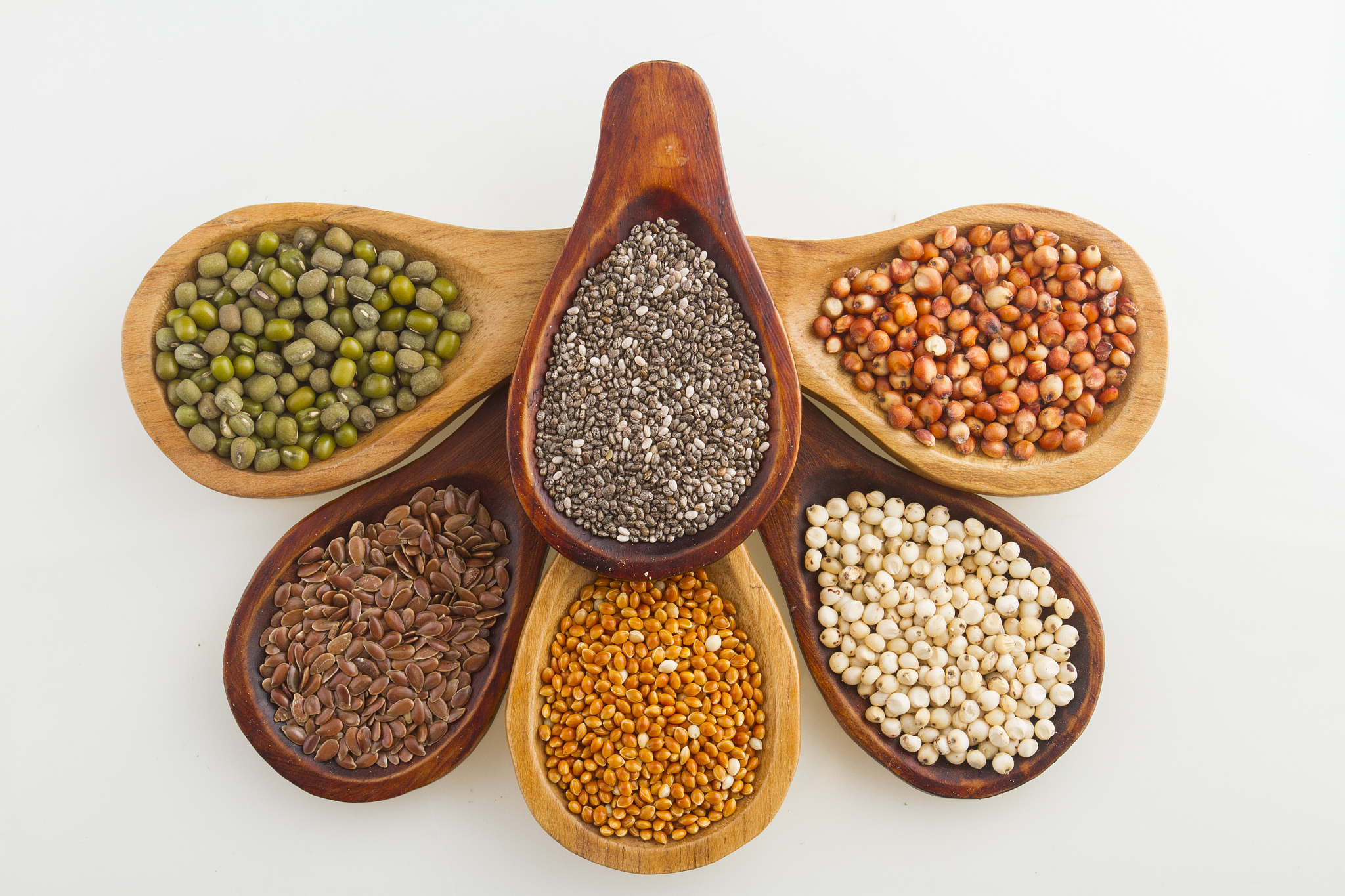 wooden spoons with assorted grains of super foods, gluten free