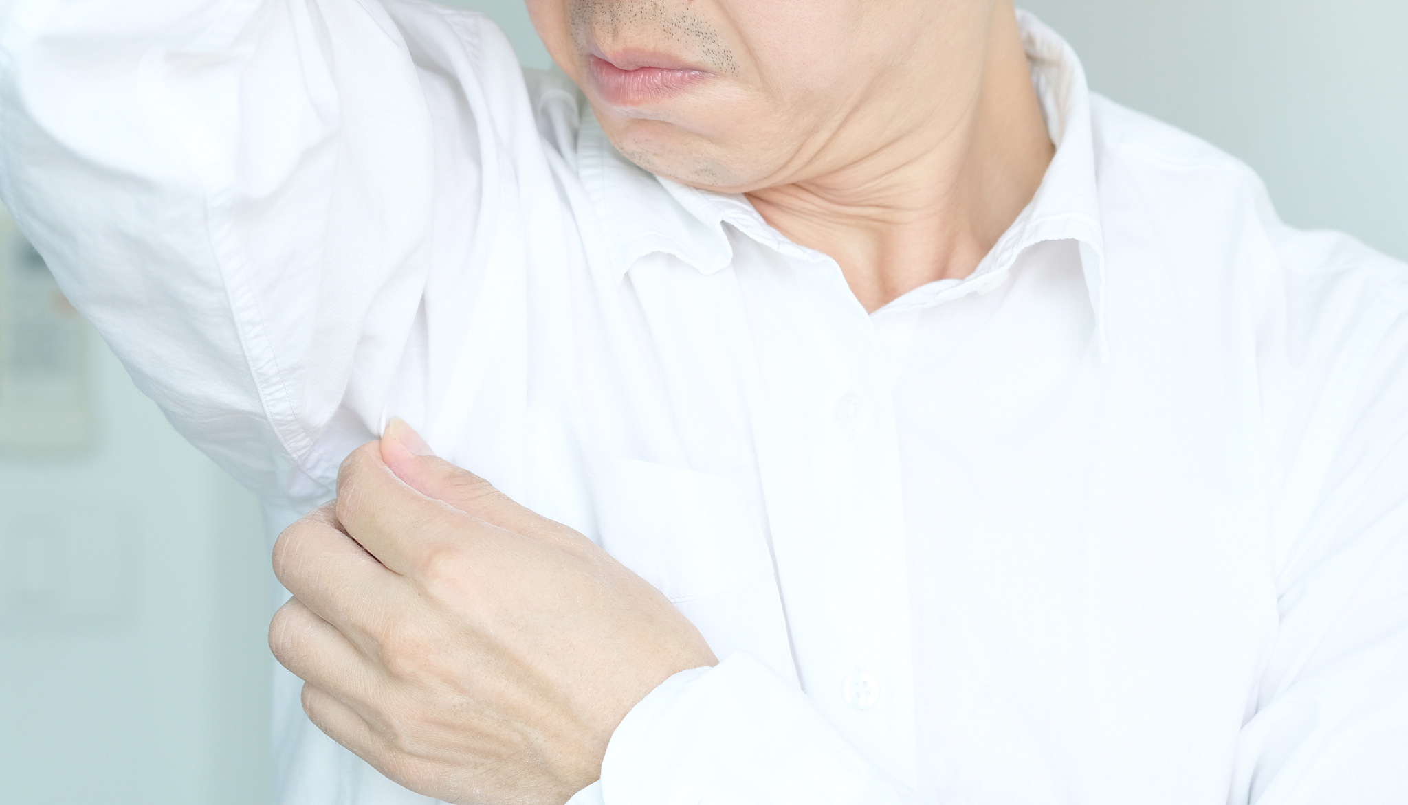 men wear white sleeves, arms are covered with armpits, sweat are