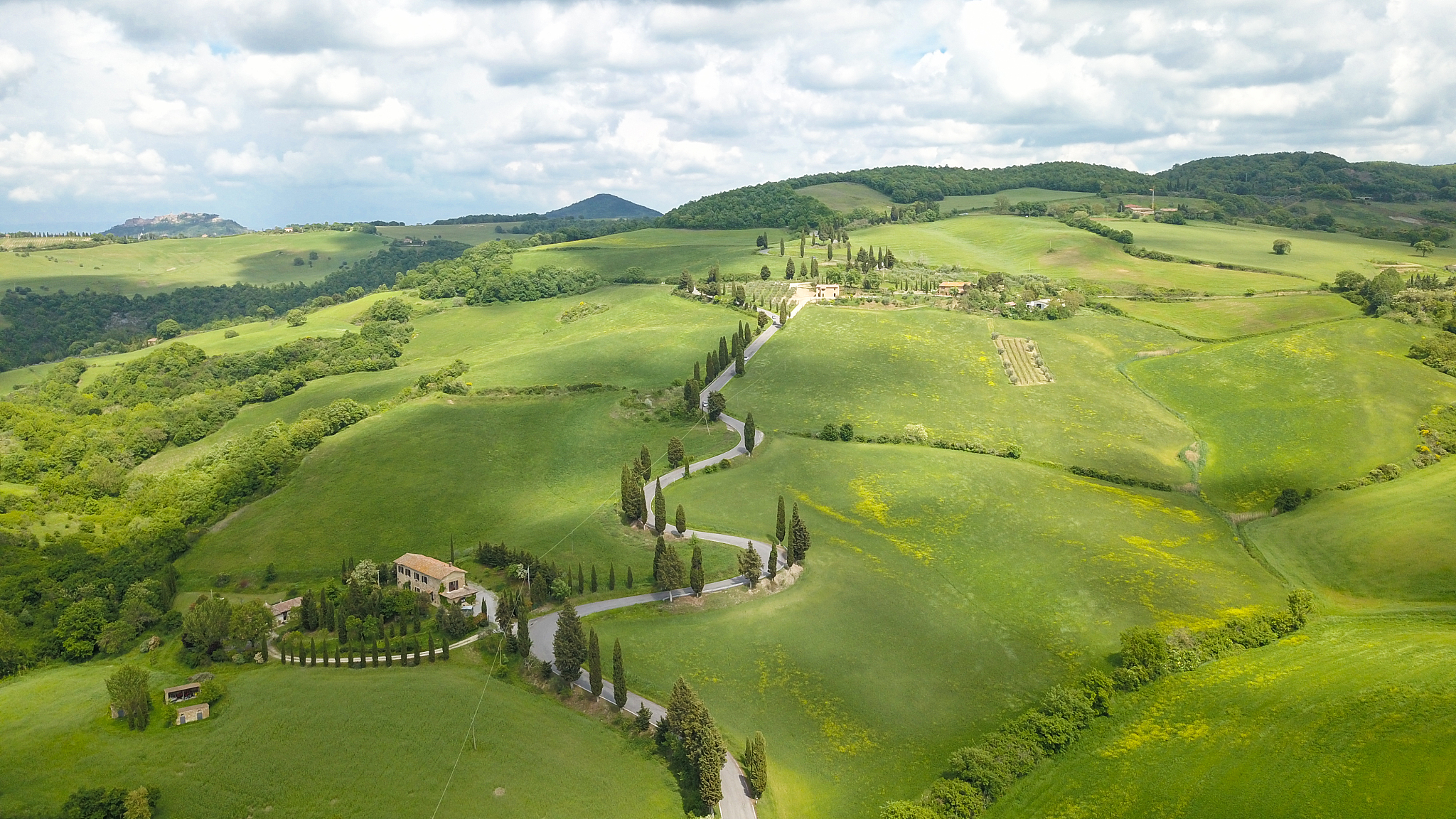 aerial of cypress road near small village of monticchiello, tusc