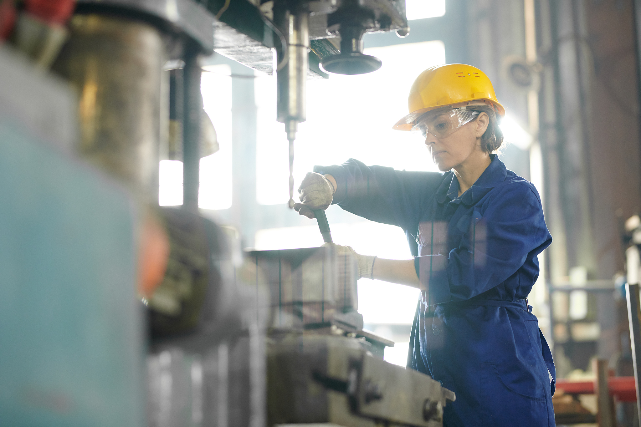 female mechanic repairing machines