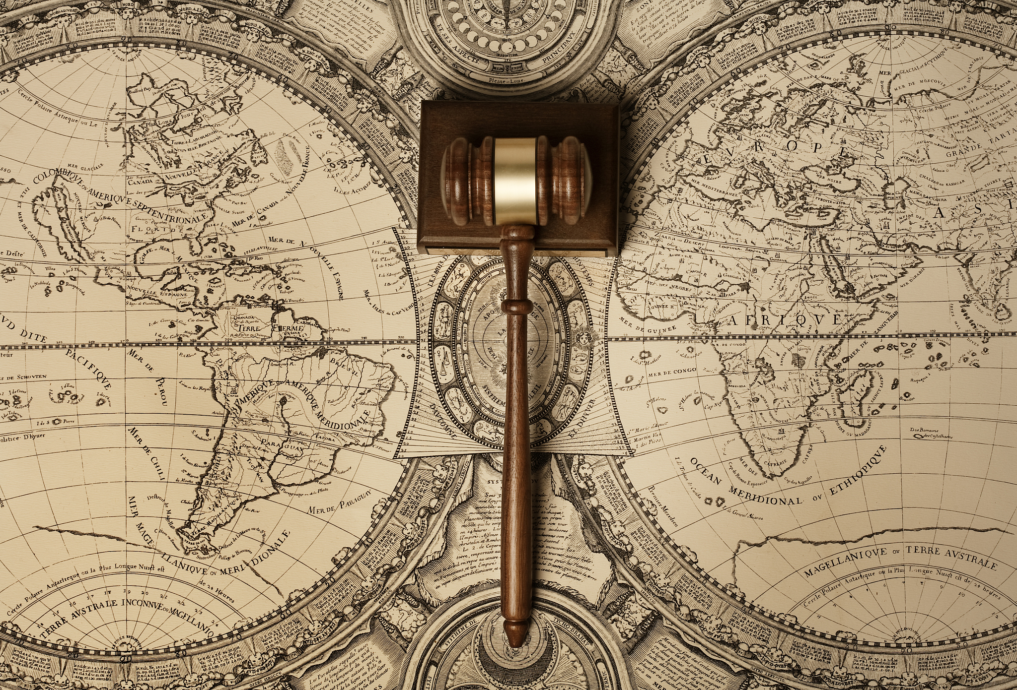 gavel on old world map