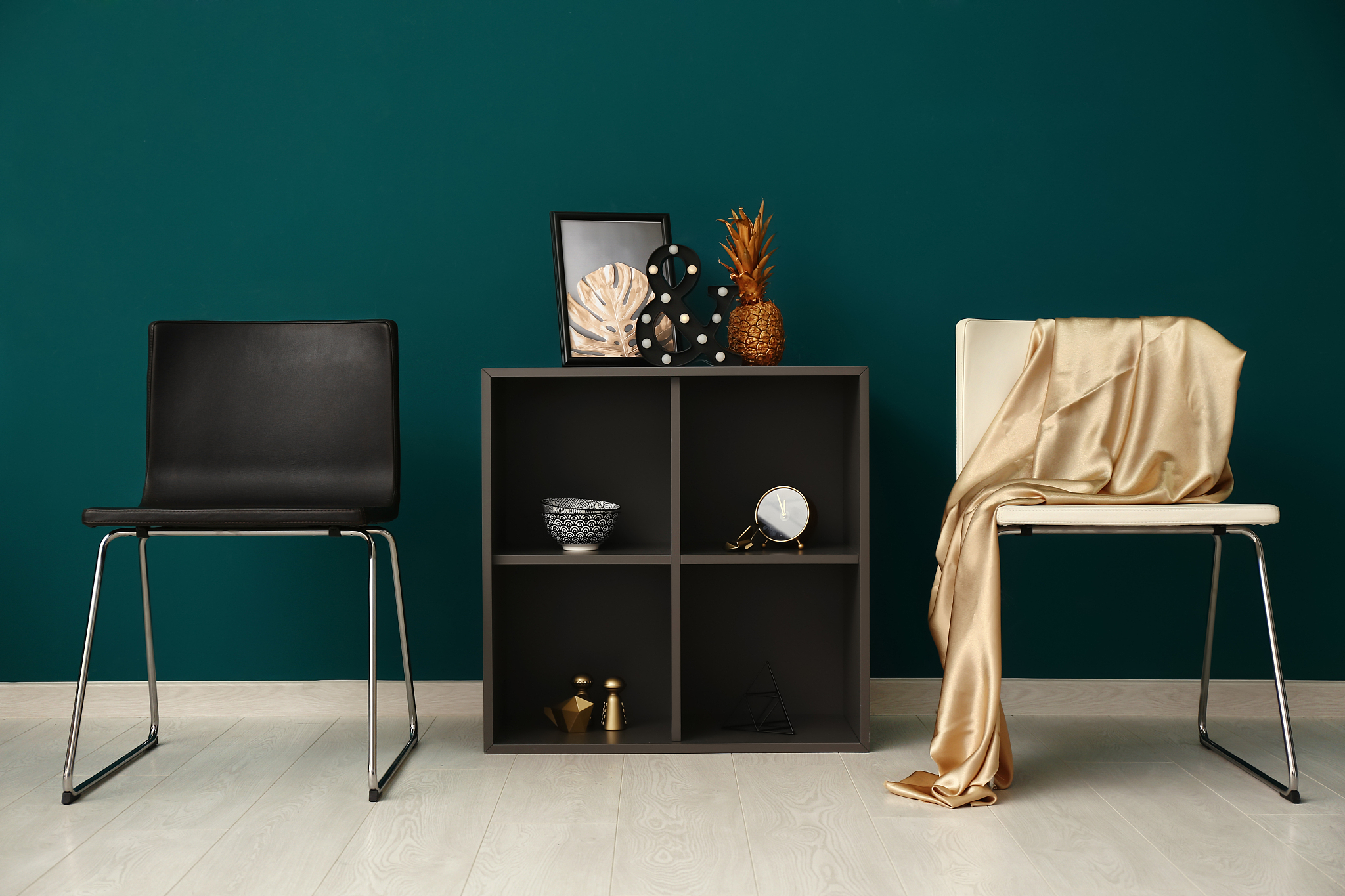 stylish furniture with golden decor near color wall
