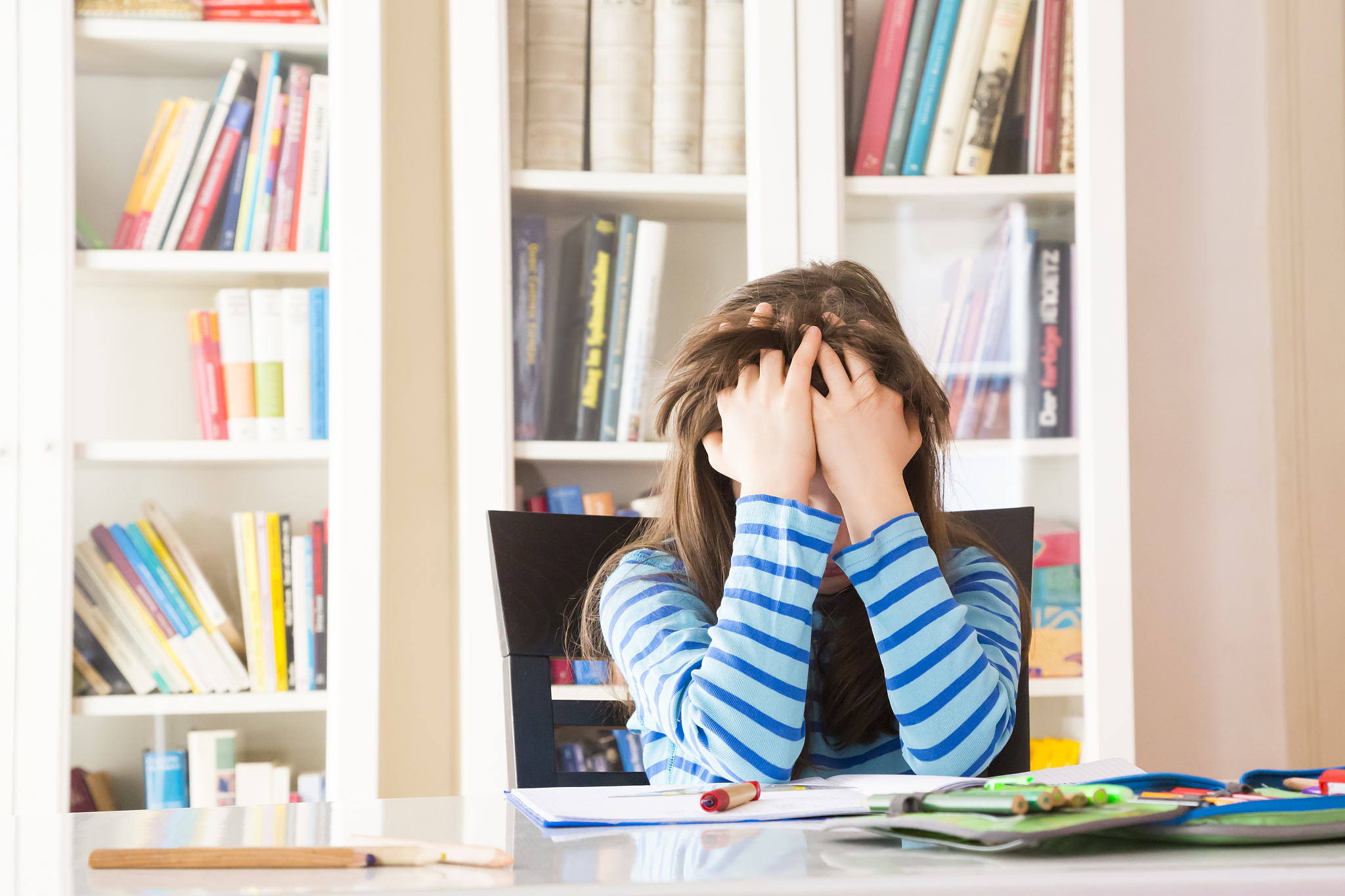 frustrated girl doing homework