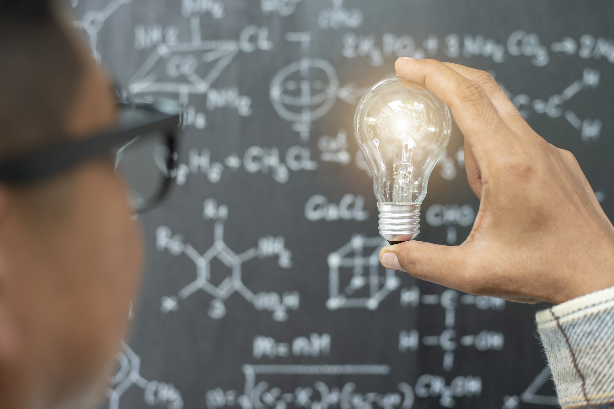 a hand holding is light bulb, creative ideas concept, lightbulb 