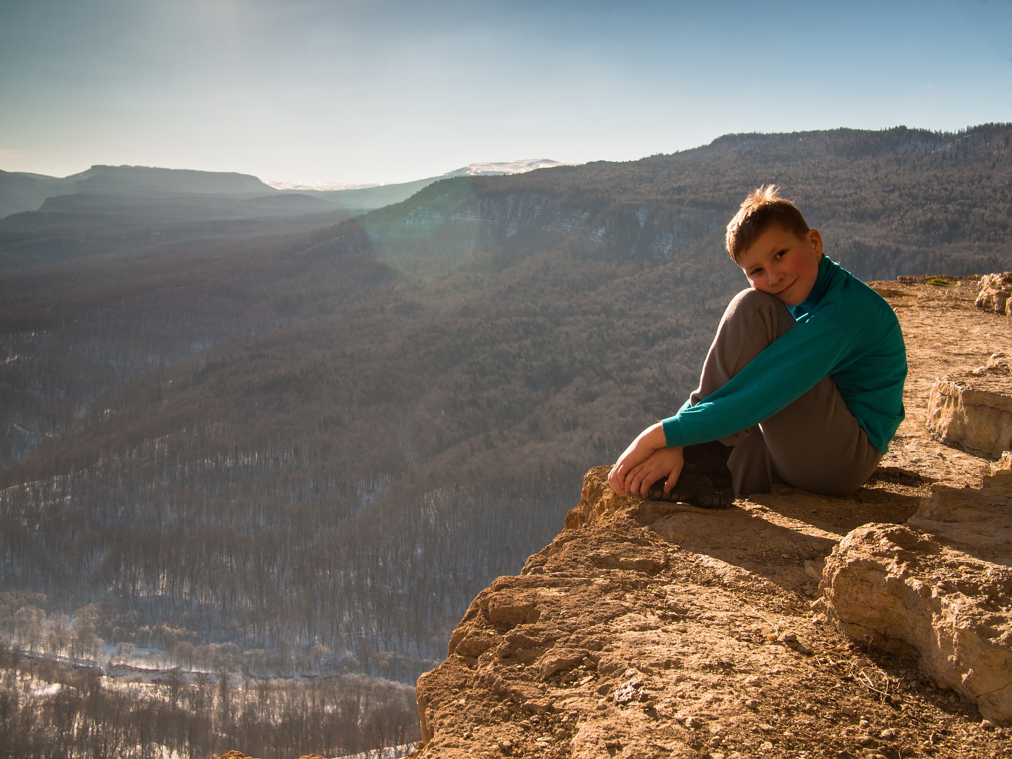 boy sitting on the edge