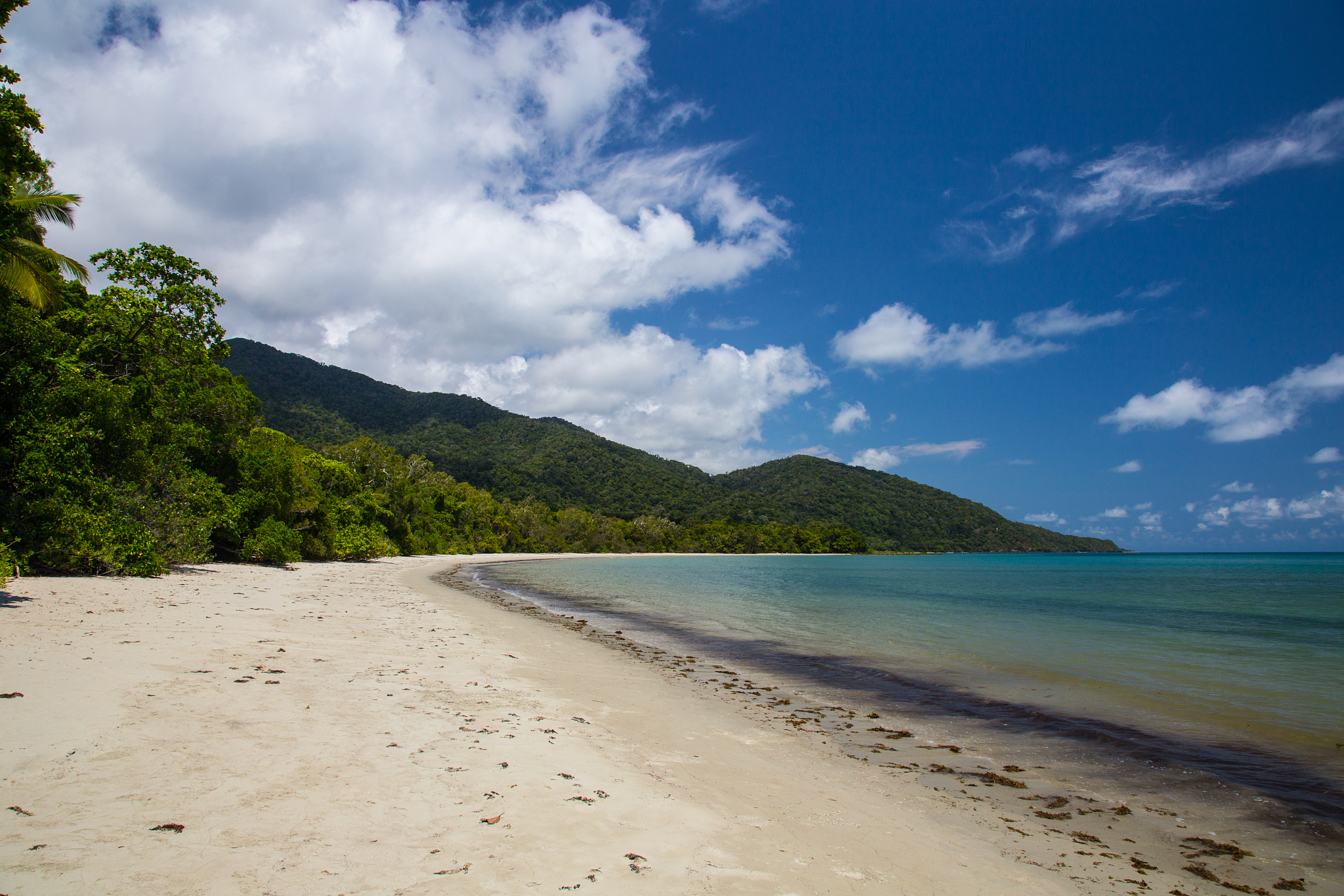 no people at a beautiful lonely beach, but the water is too dang