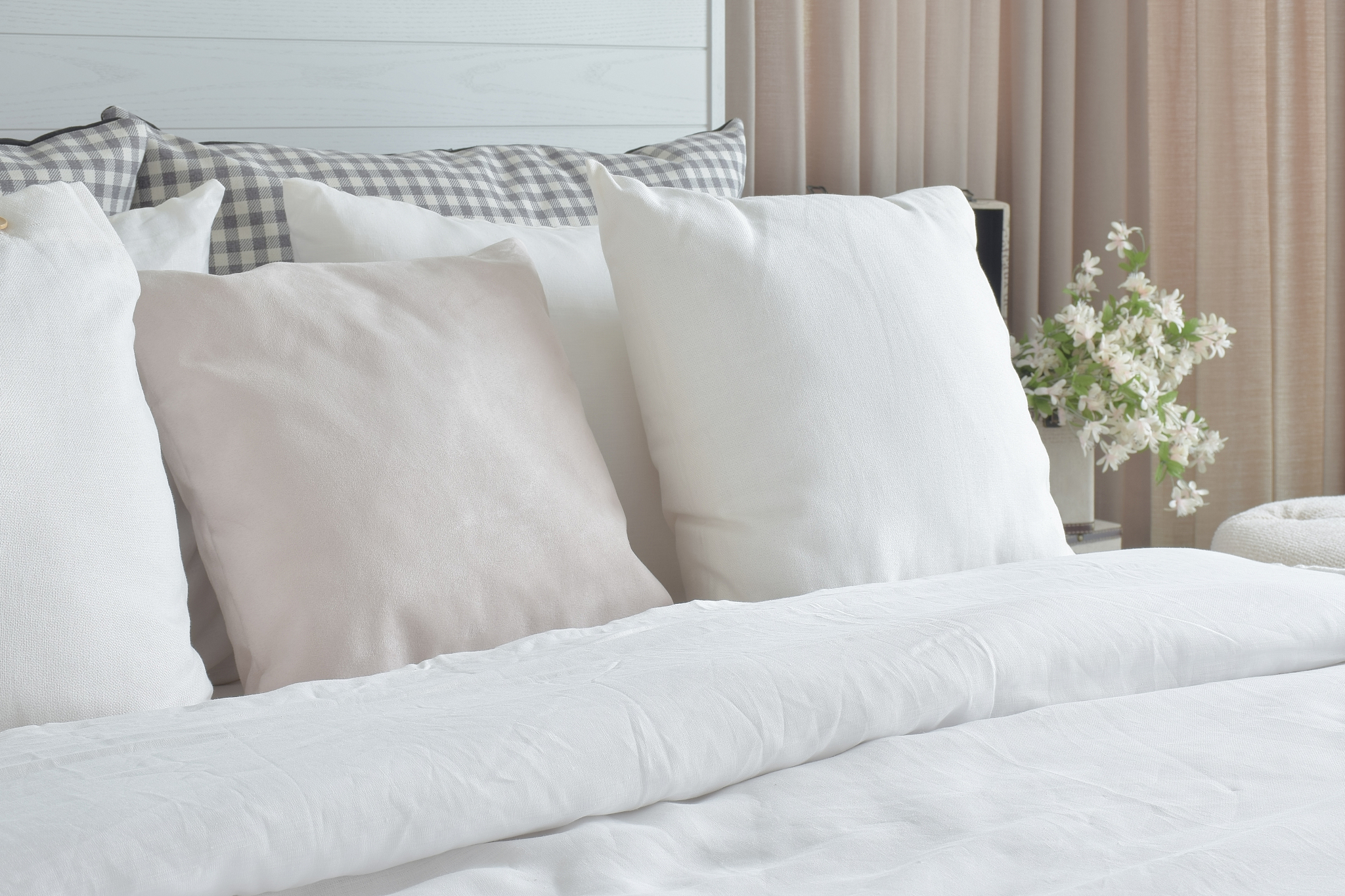 off white pillows setting on bed with english country style bedd