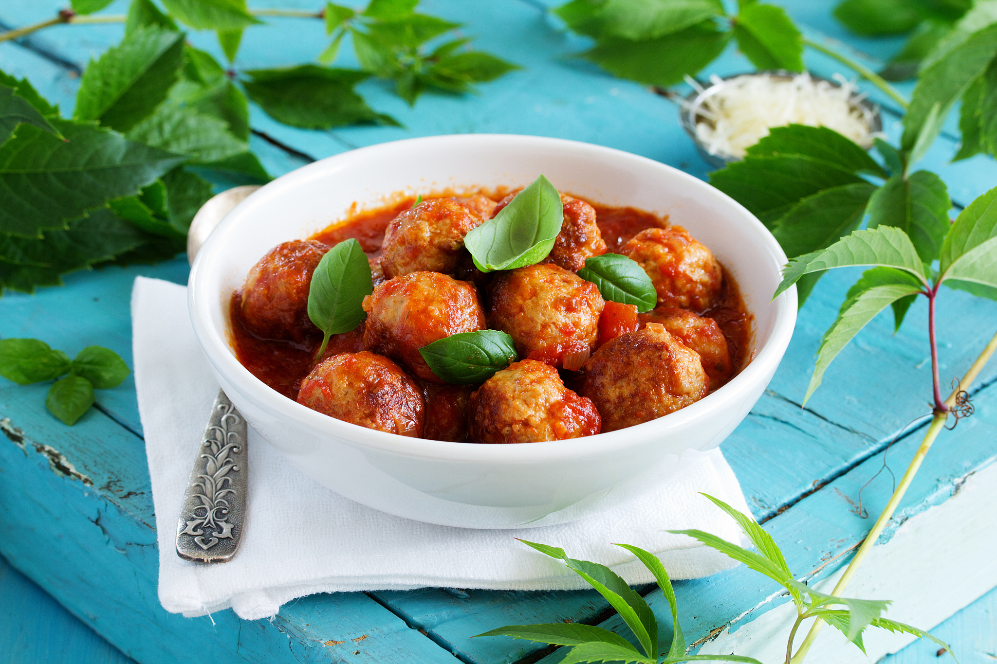 meatballs in tomato sauce with basil.