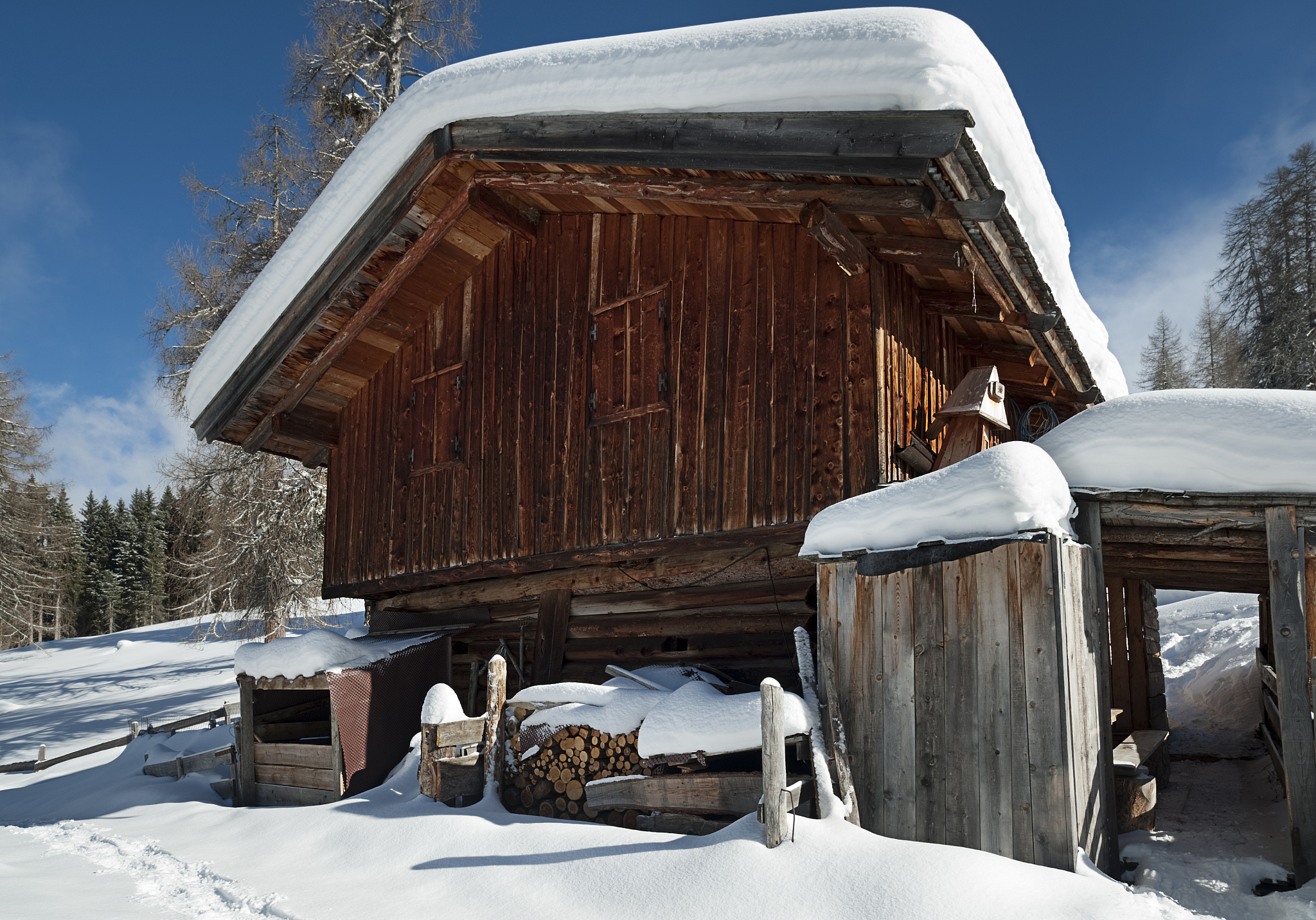 Wooden house on snow mountain