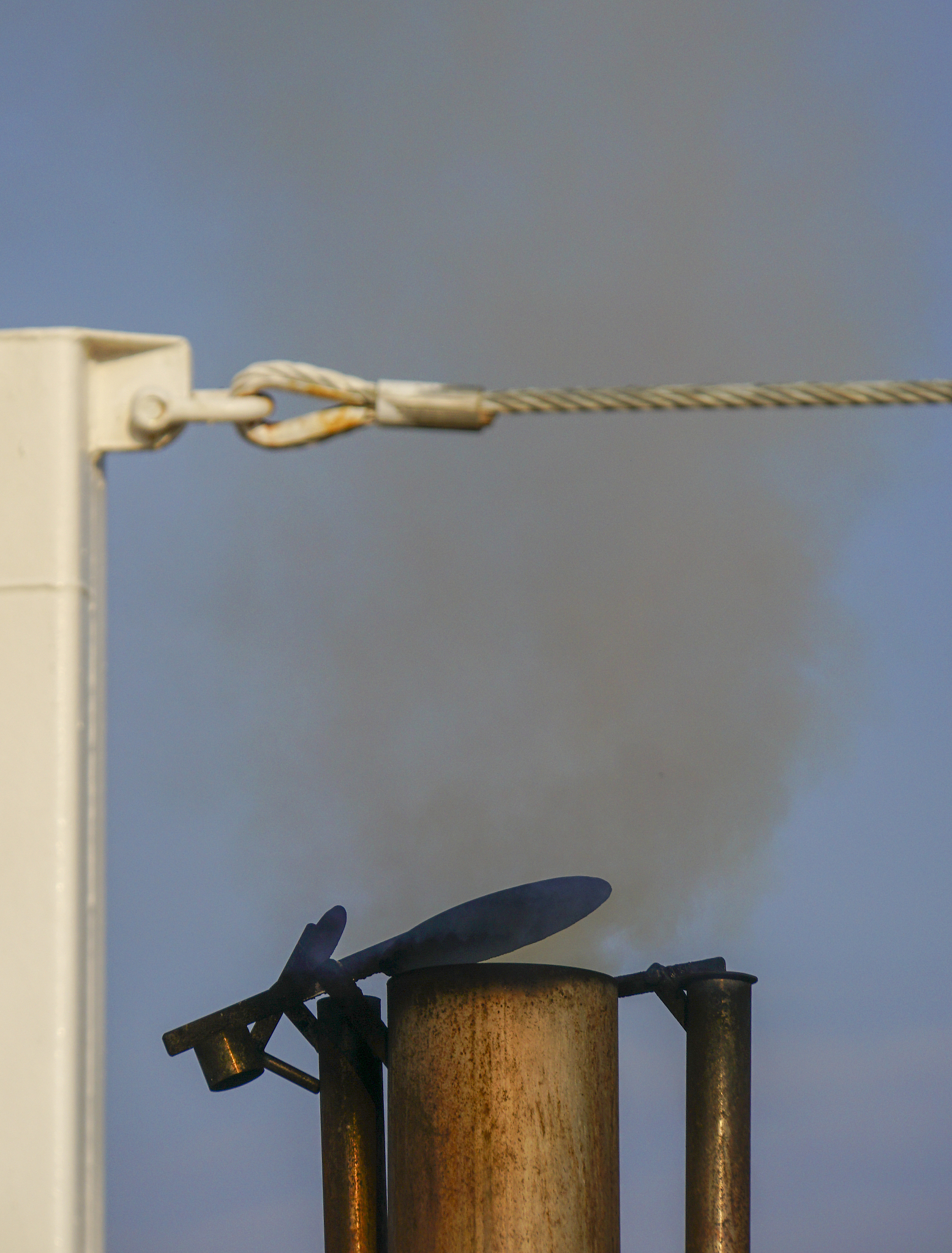 exhaust pipe emitting smoke and fumes