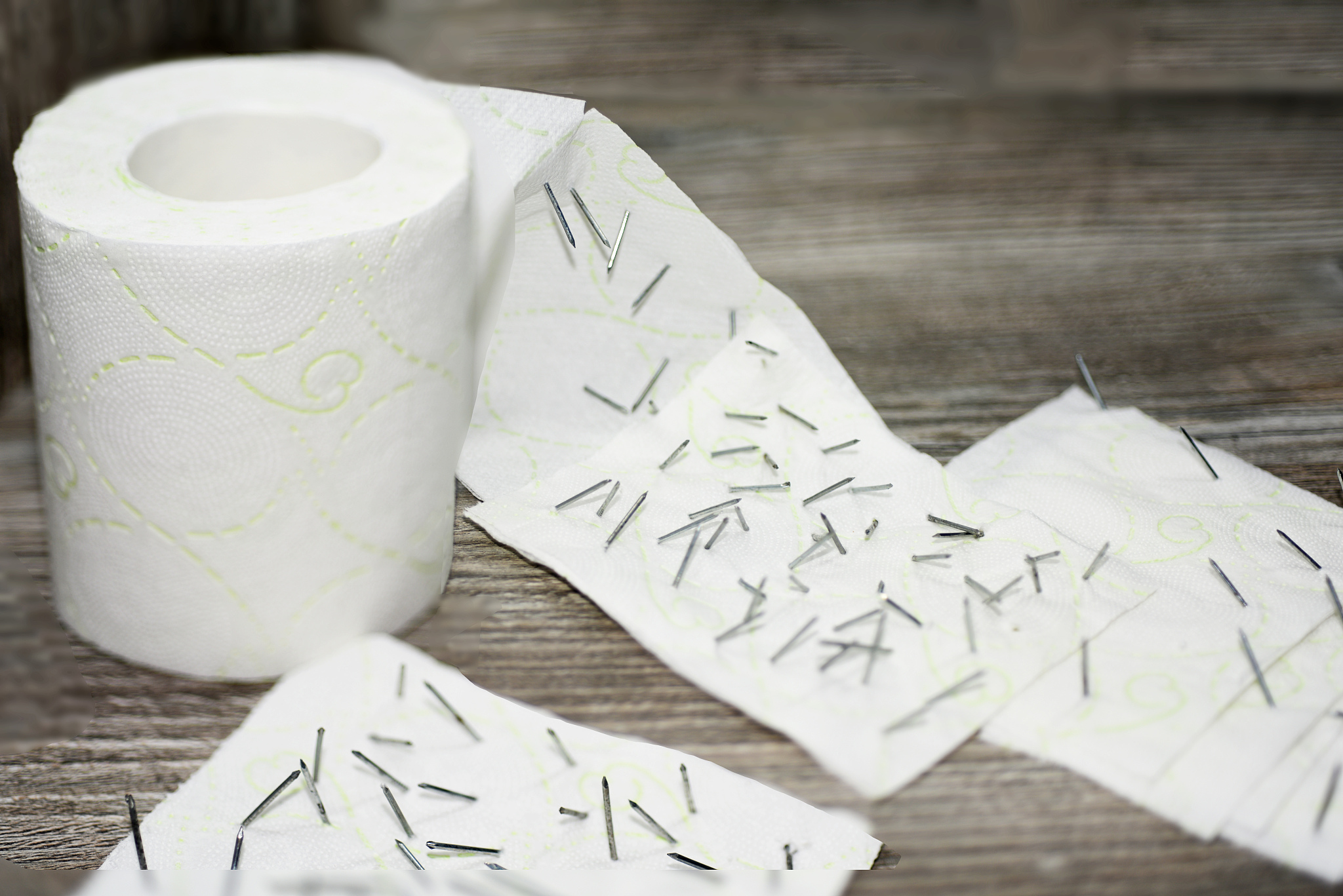 toilet paper with nails in it.
