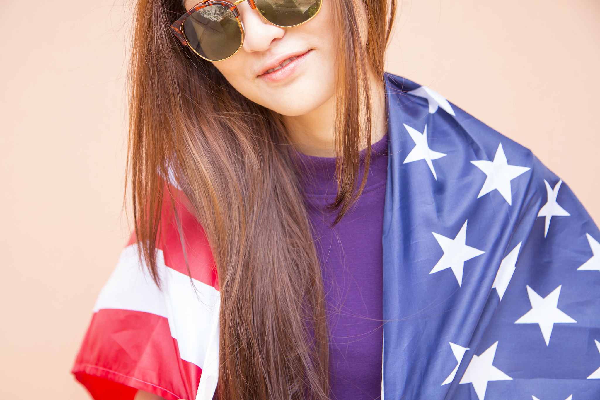 fashion portrait of hipster asian woman wearing sunglasses and h