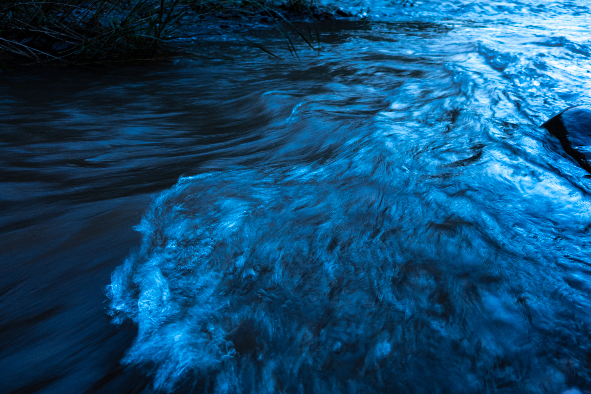 stream of flowing river in the evening light
