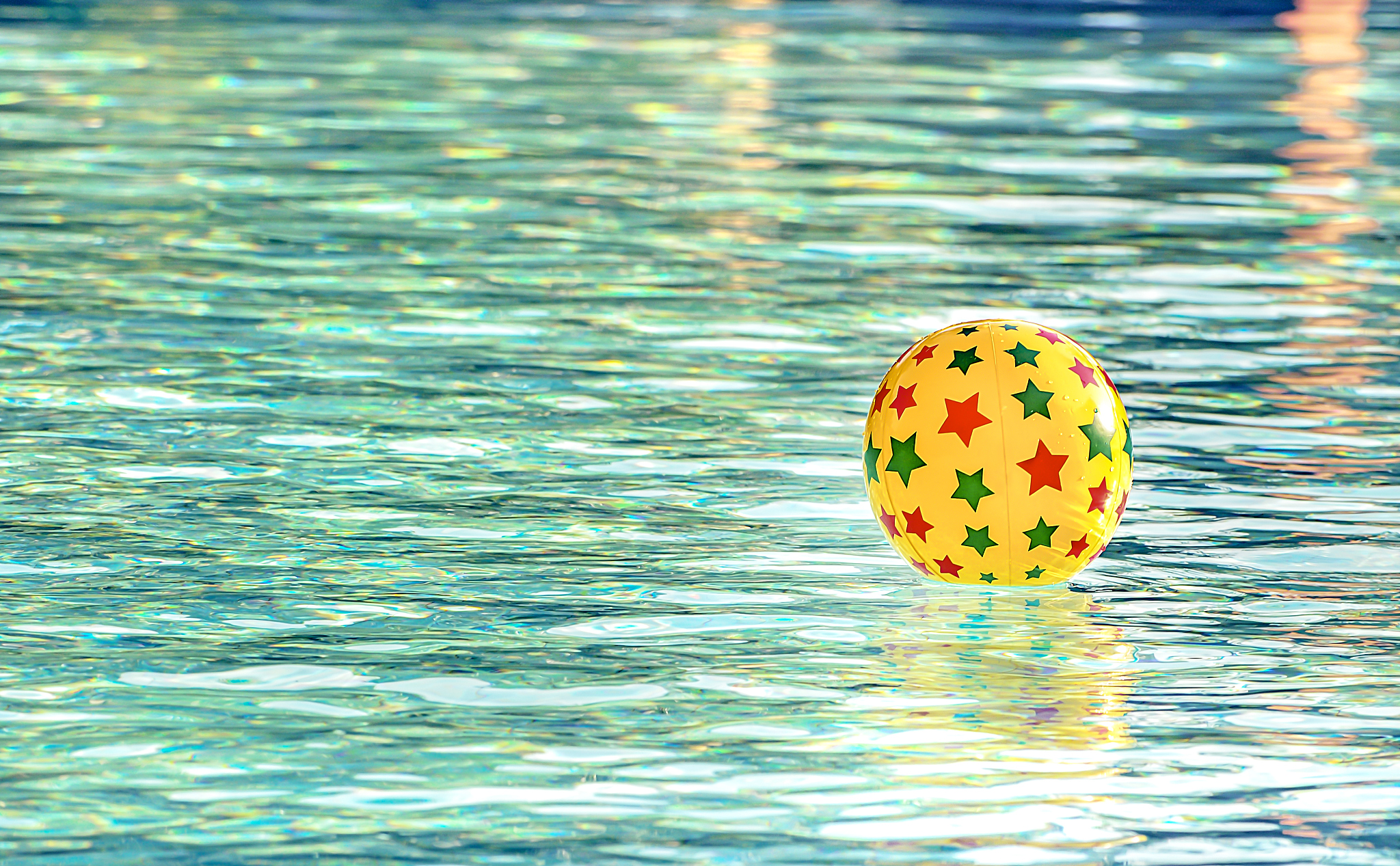 inflatable ball floating in swimming pool