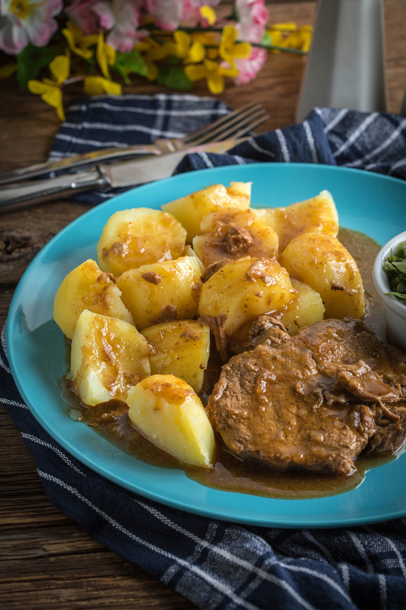 braised meat in sauce served with boiled potatoes.