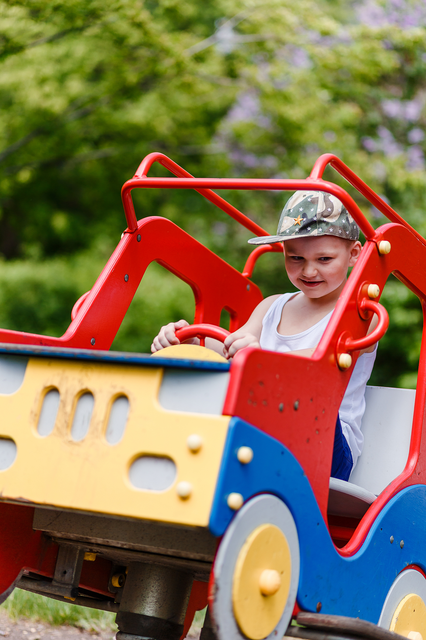 seven-year-old boy rides a children's car gurney