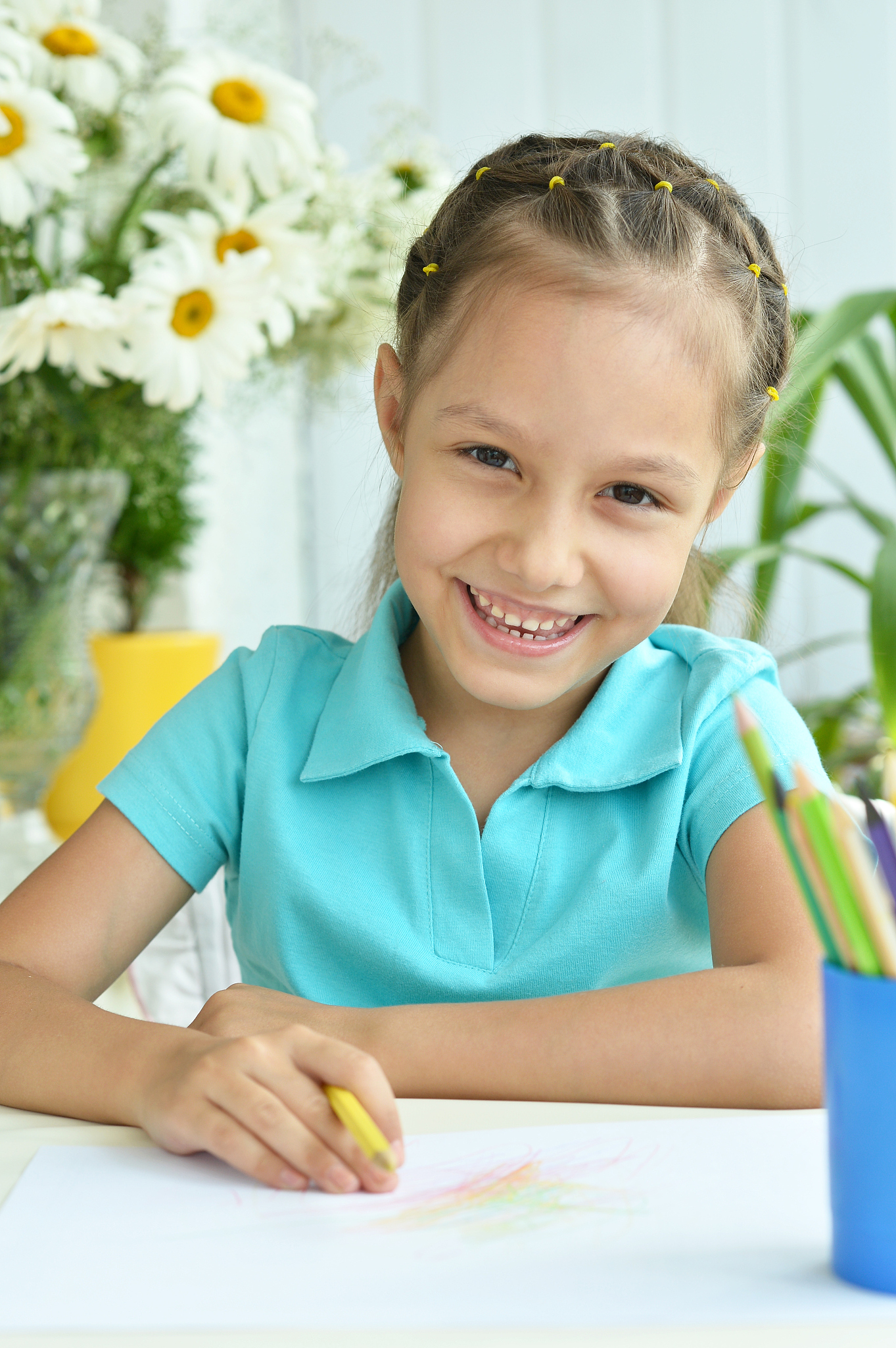 little girl drawing at home