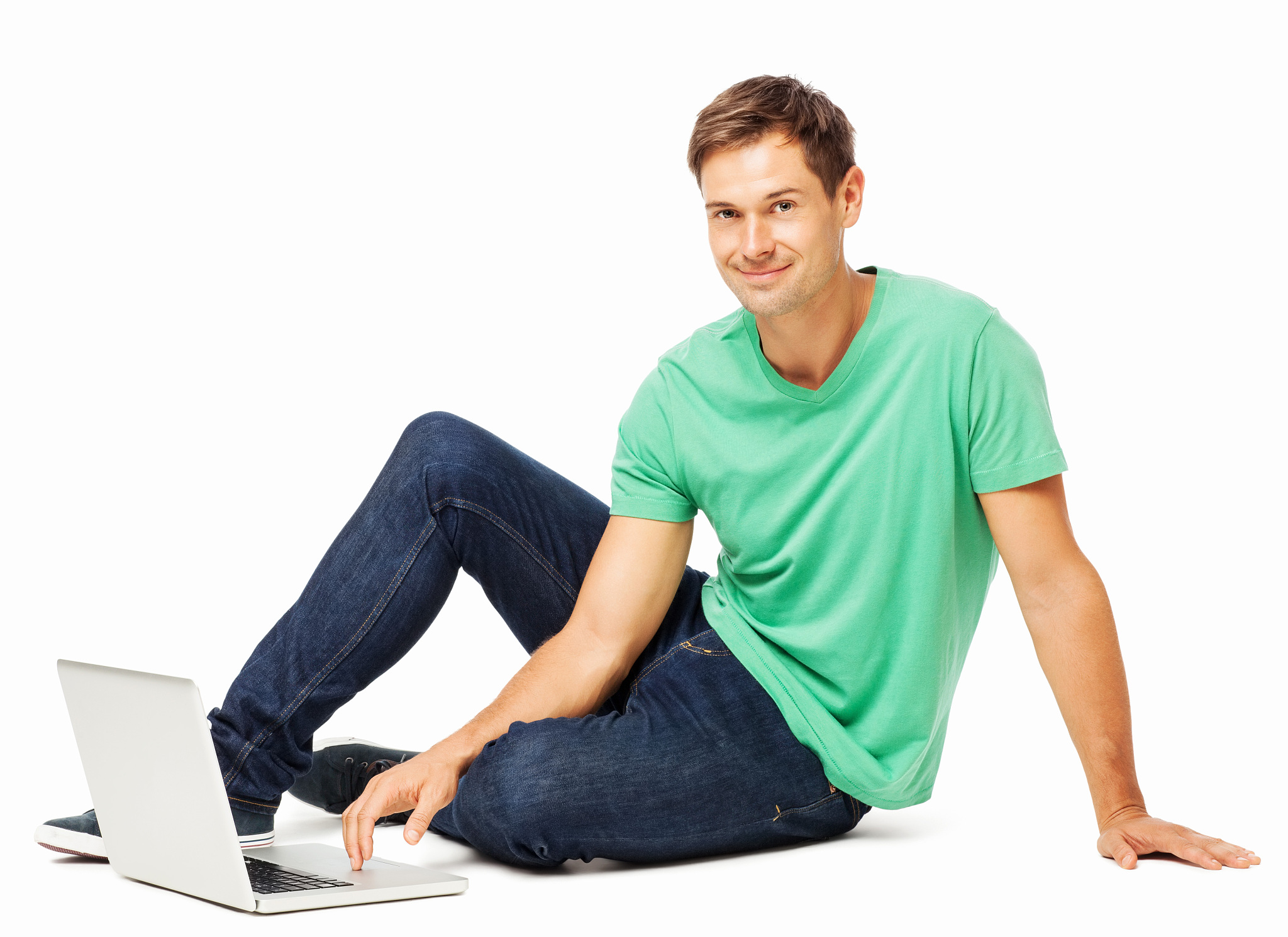 handsome man using laptop on floor