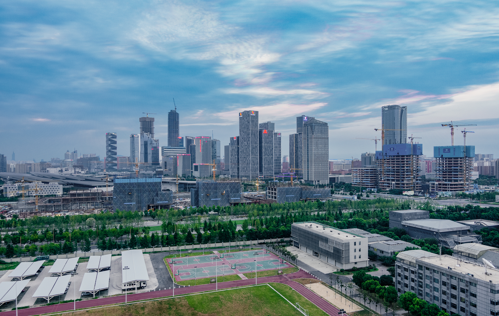 city buildings in cloudy weather at sunset  in nanjing, china
