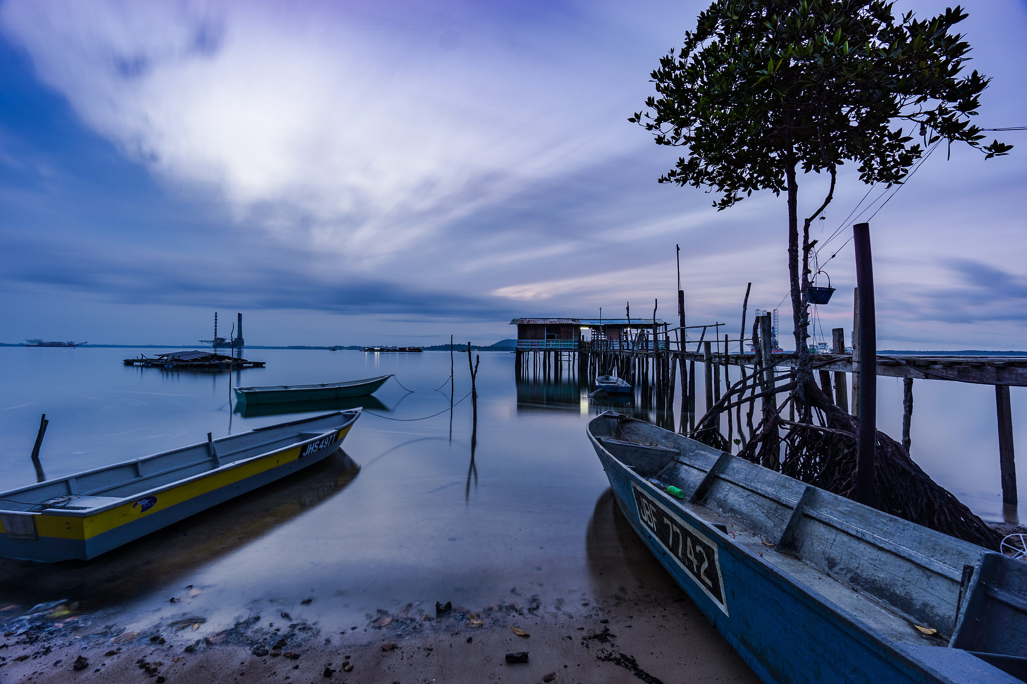 magical scenery of wooden jetty and small boat