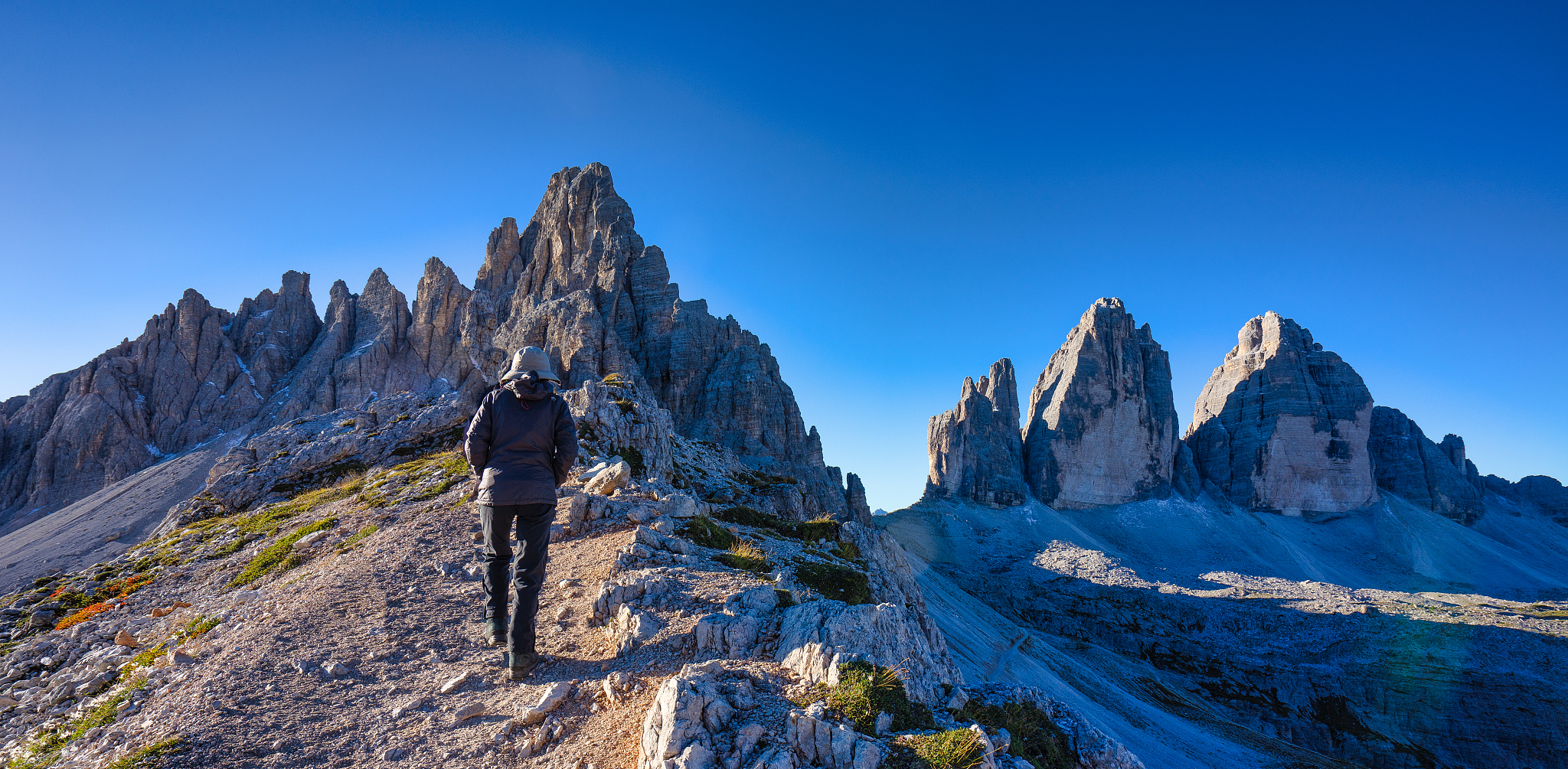 woman hiking along a trail, tre cime di lavaredo, dolomites, sou