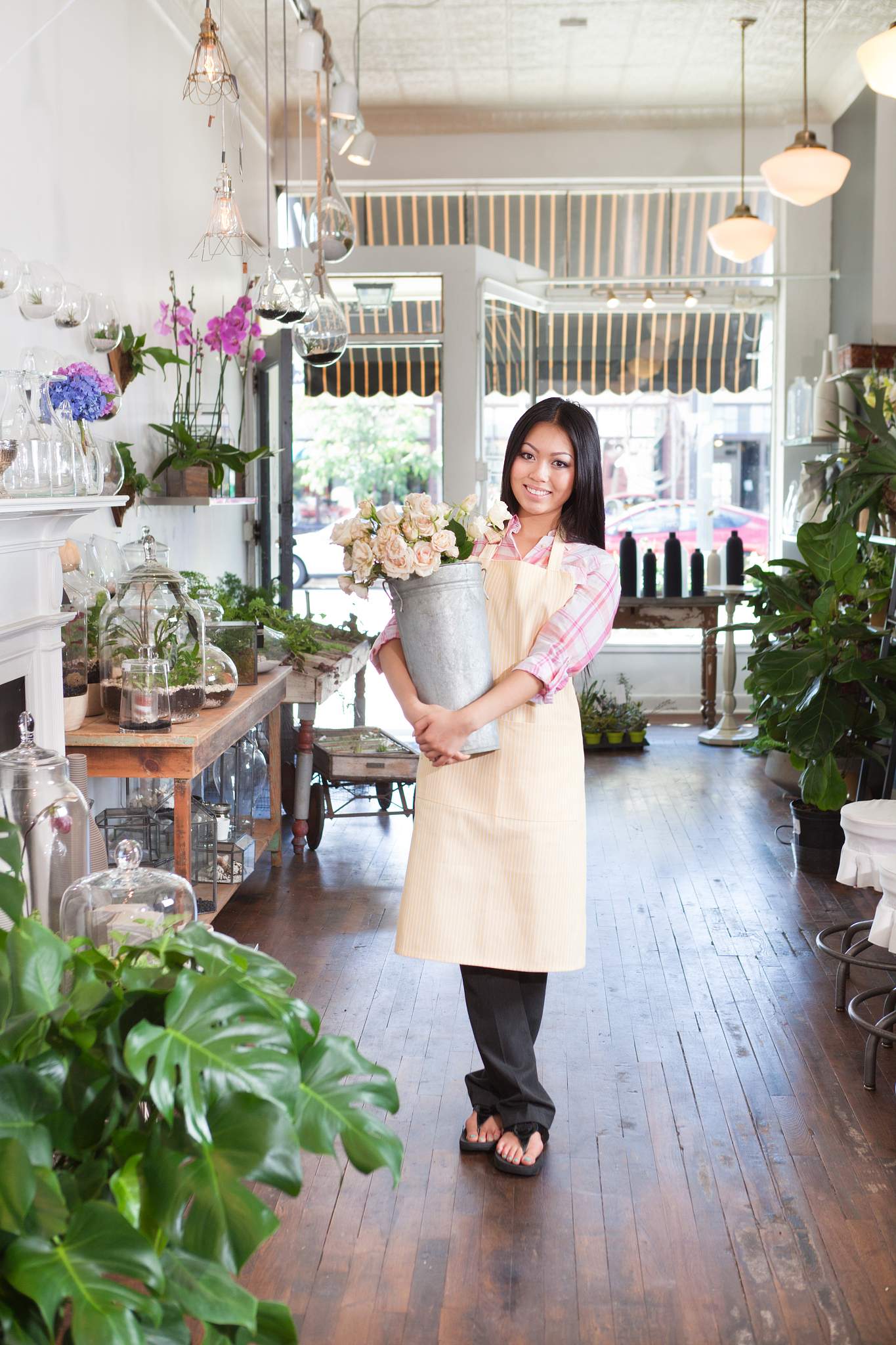 proud woman entrepreneur small business owner in her retail shop
