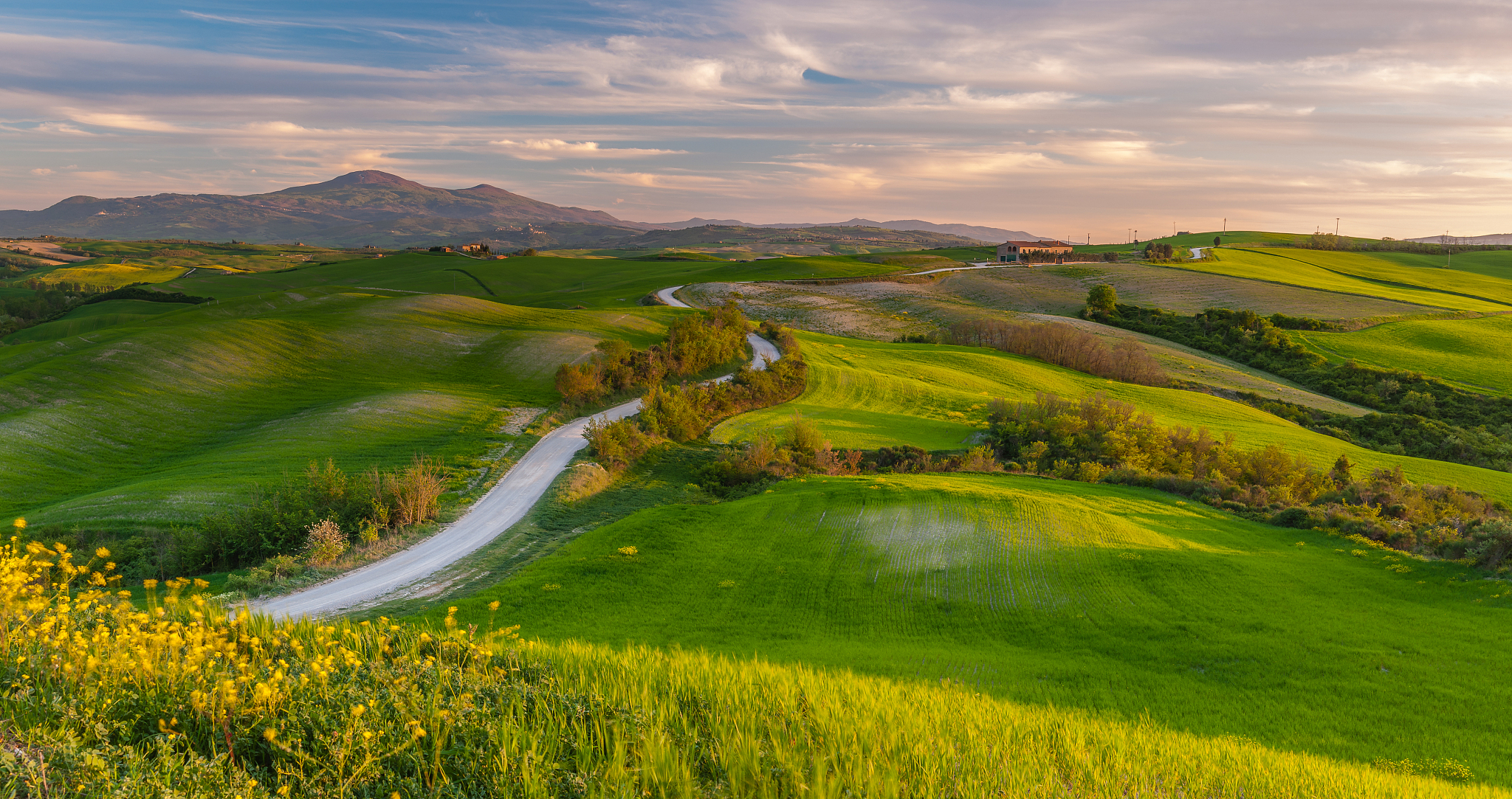clouds over rolling landscape