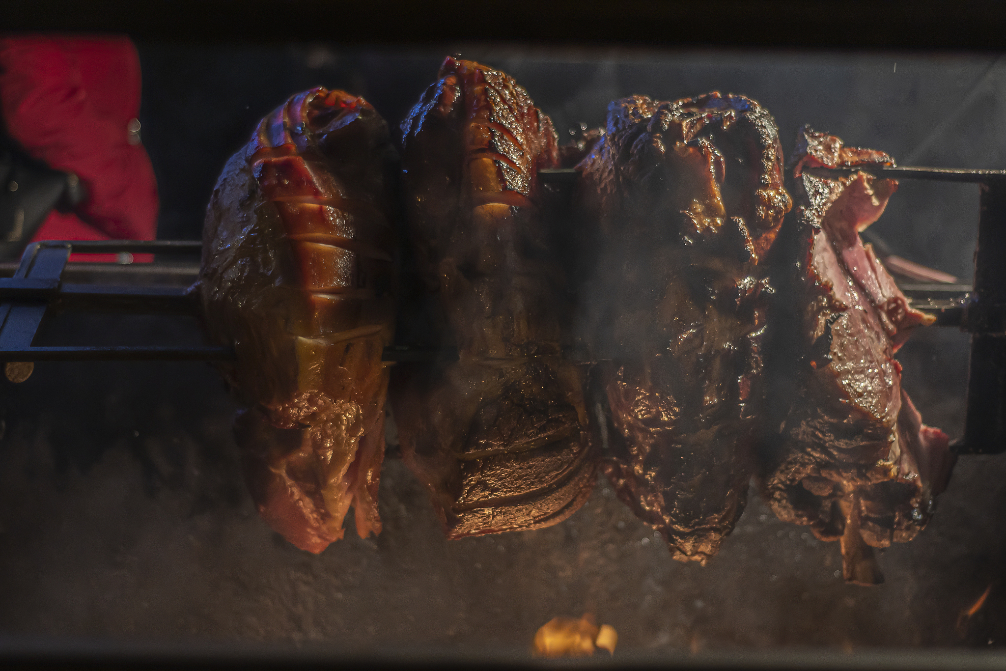 large pieces of meat grilled on a spit.