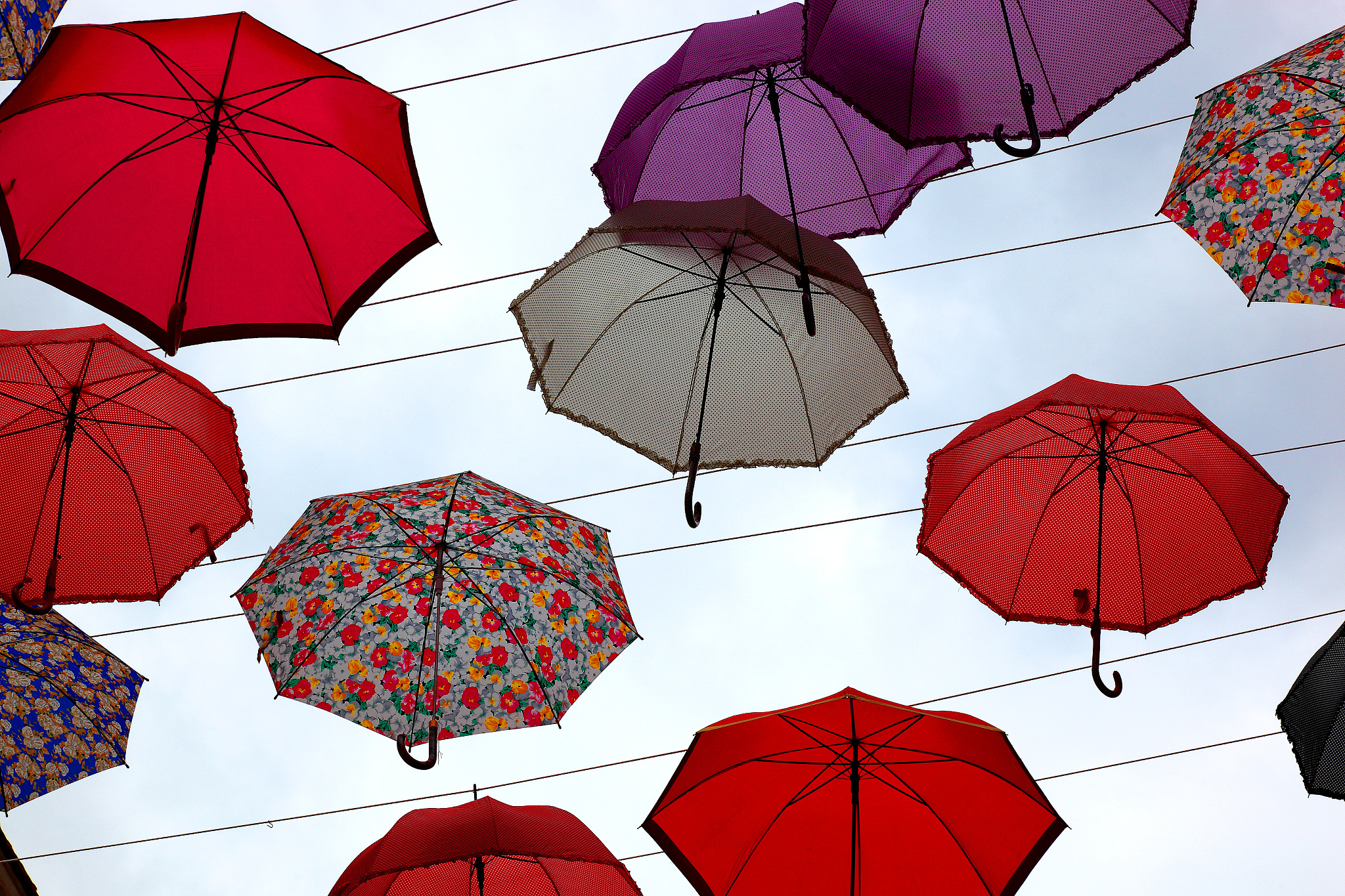 lot of colorful umbrellas in the sky