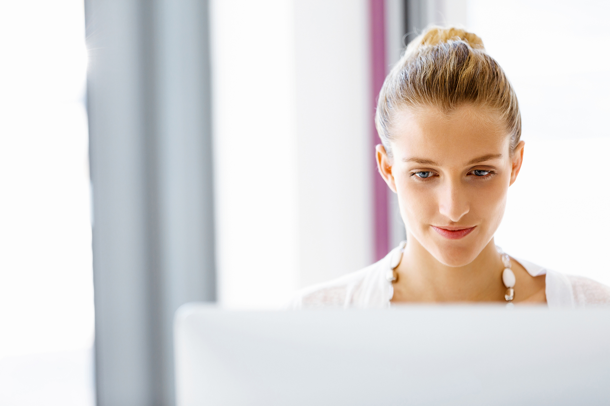 attractive office worker sitting at desk. attractive woman sitti