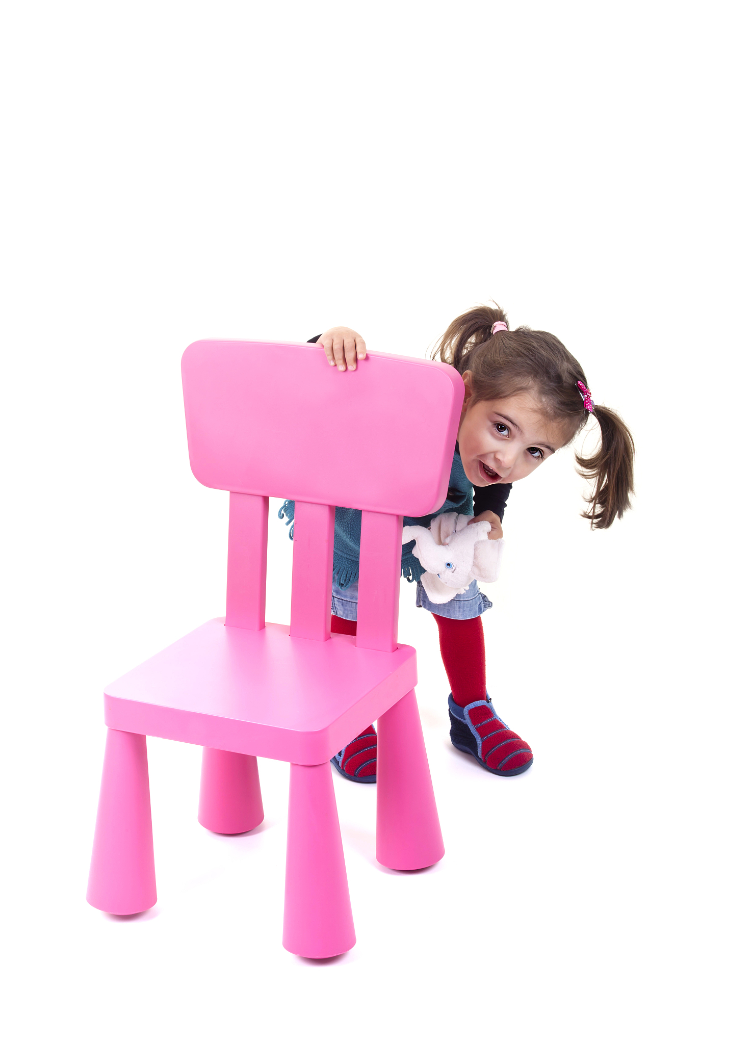 little girl with pink chair