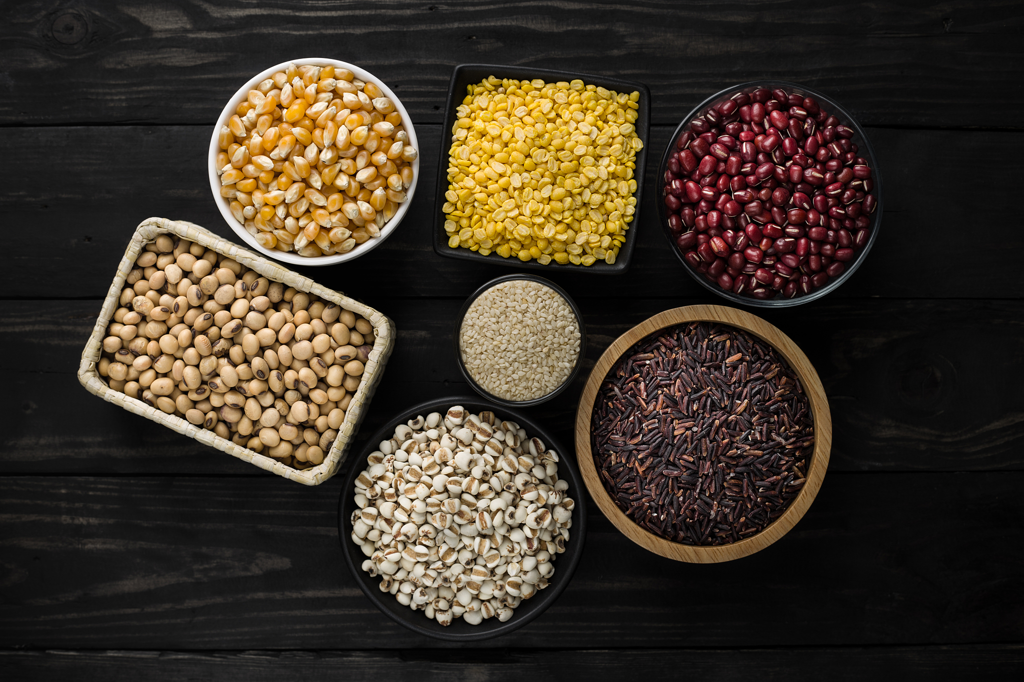 cereal grain product on wood dark background top view