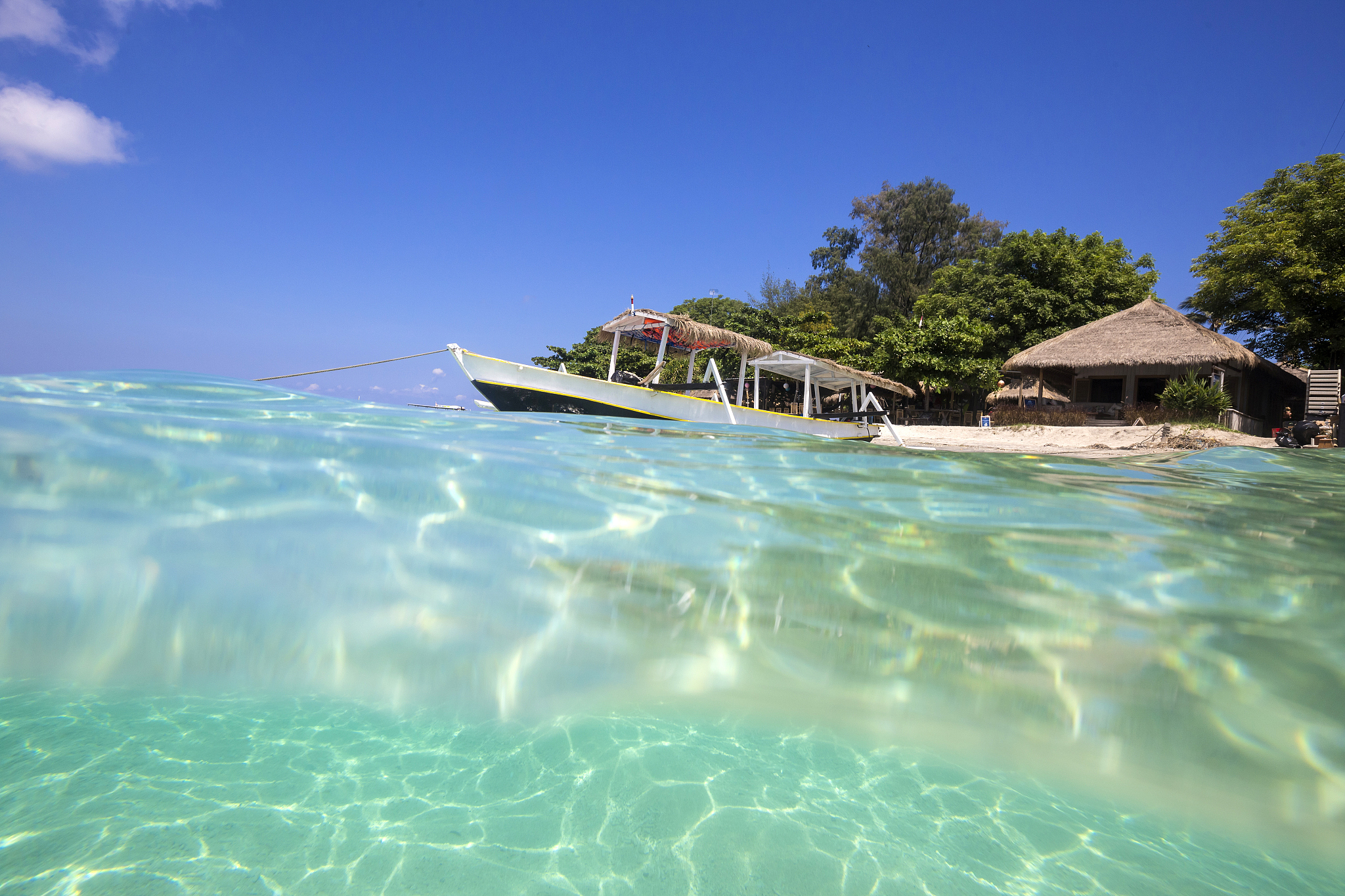 long tail boat on tropical beach