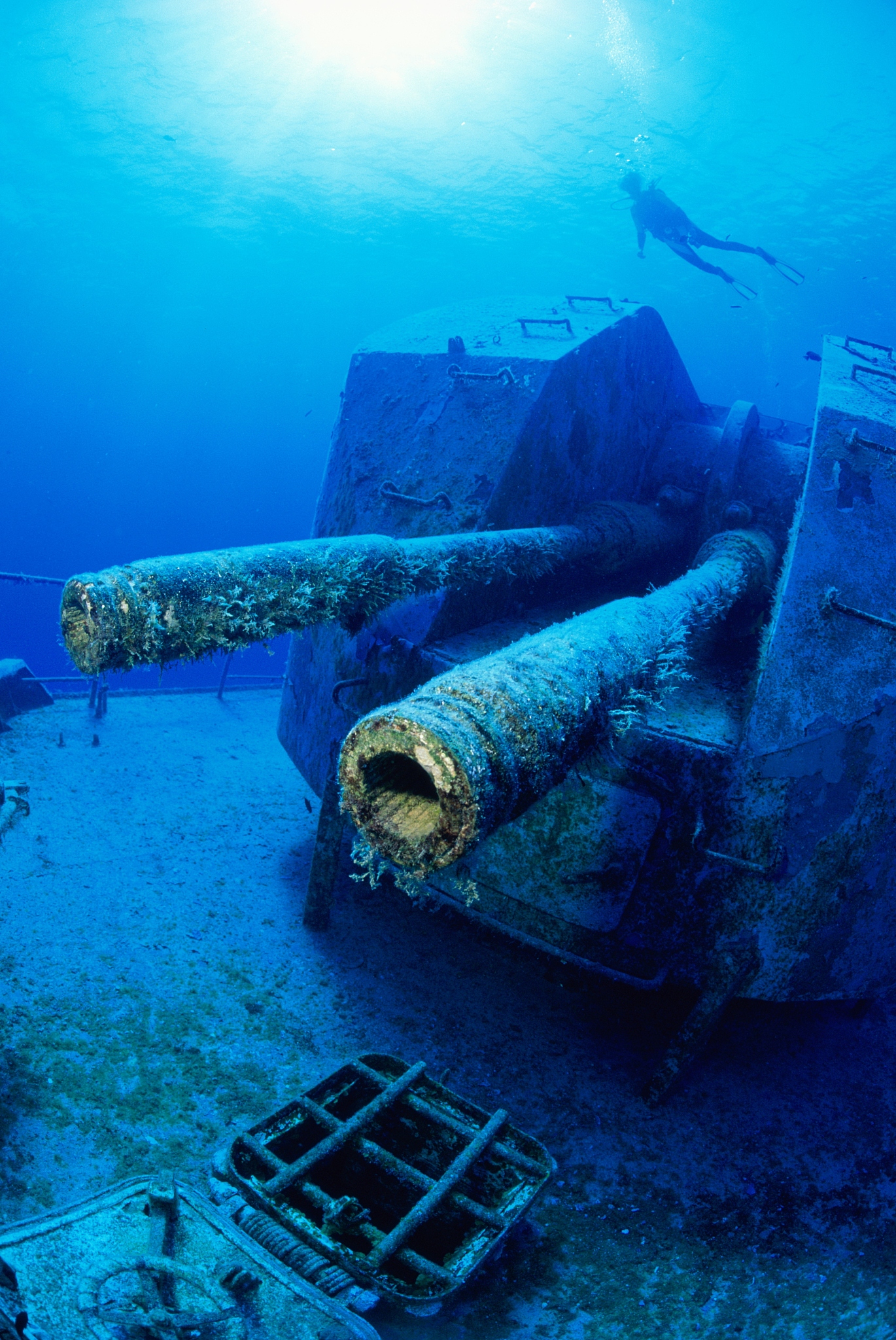diver swimming close to wreckage of russian destroyer, cayman is