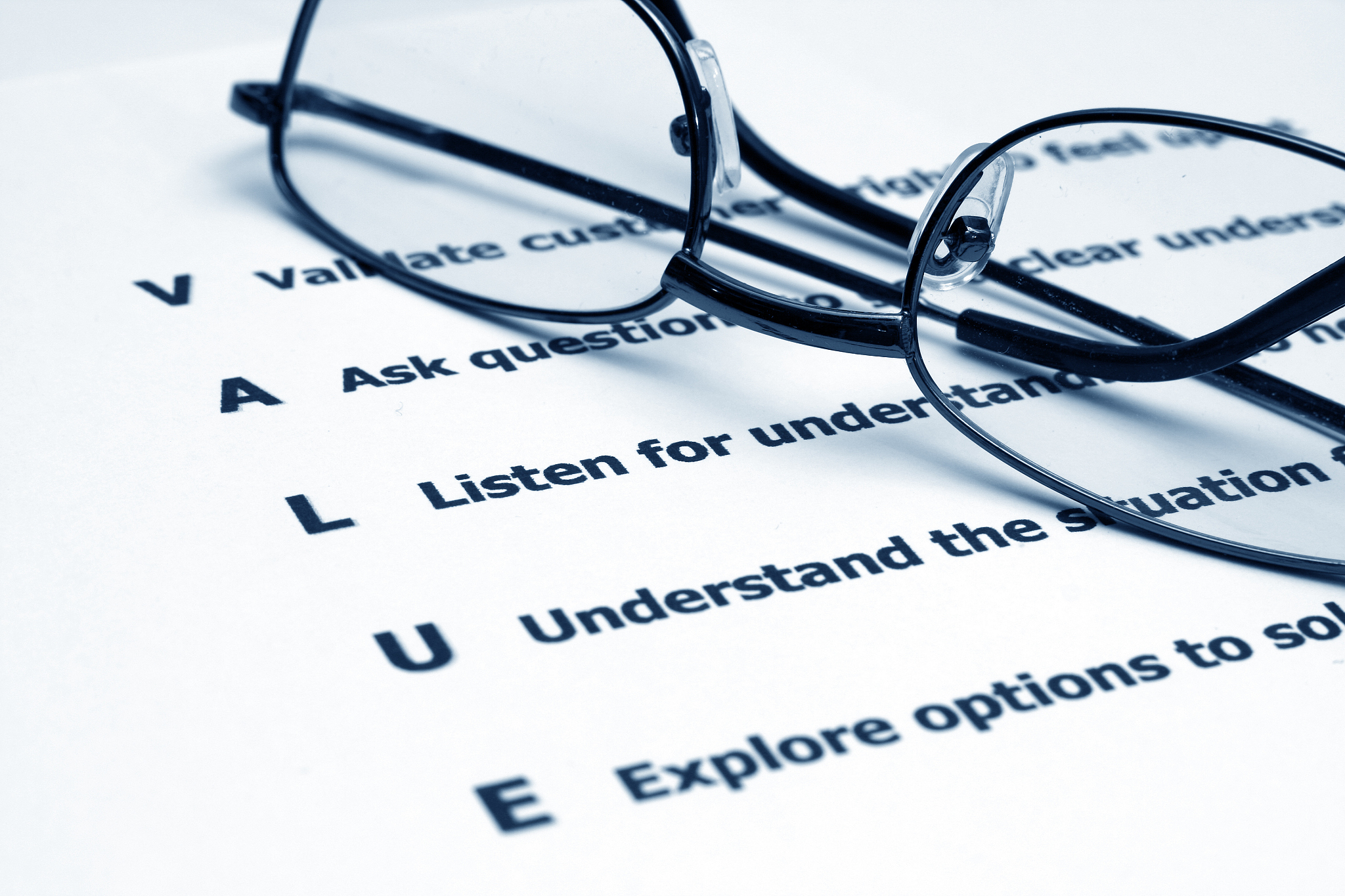 close-up of elements of value and a pair of glasses