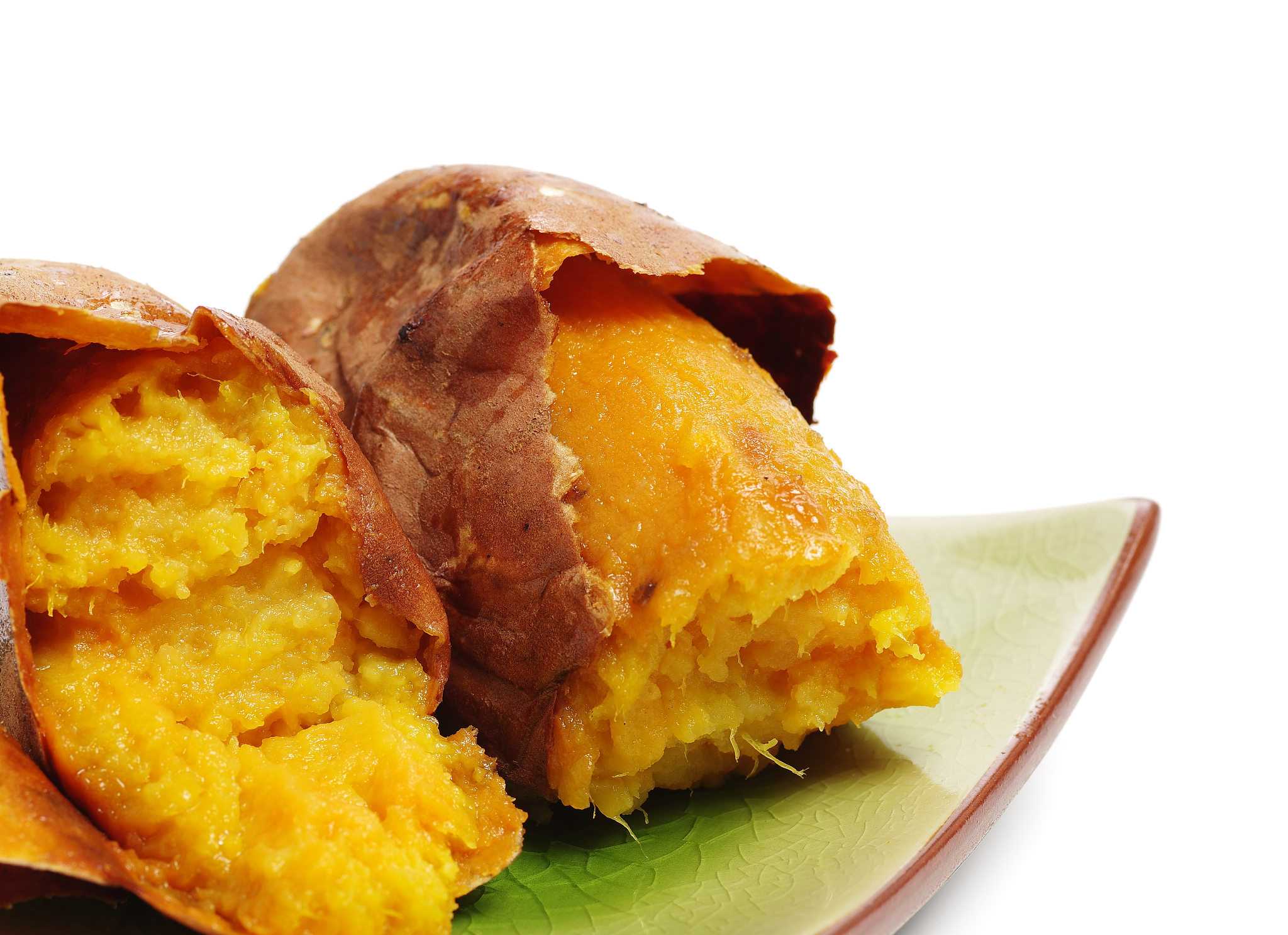roasted sweet potatoes isolated on white background