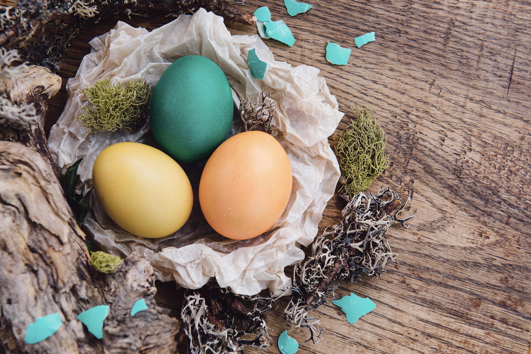 decorated easter eggs with wood, moss, natural style in spring