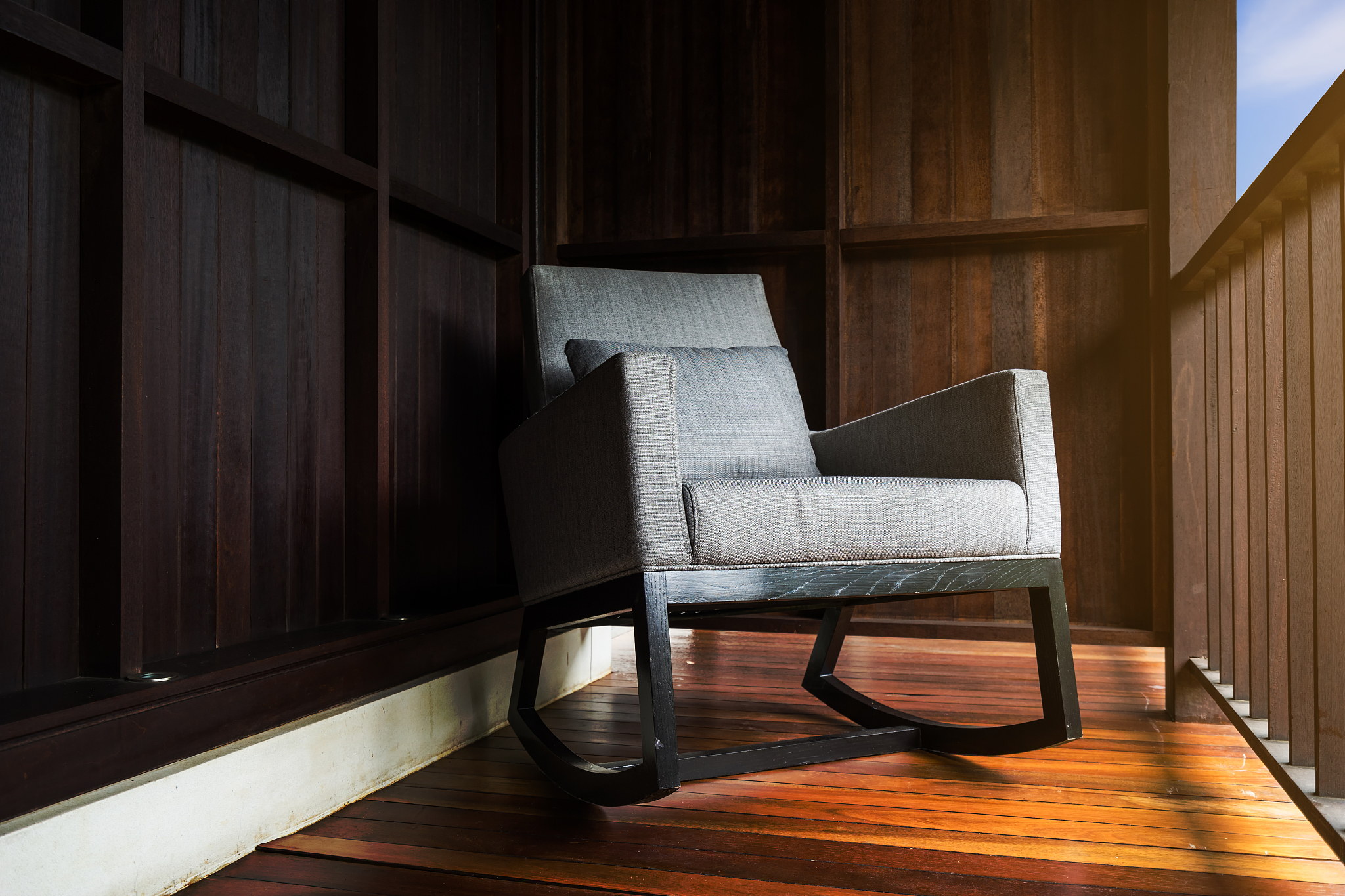 retro relax wood chair on wood house on sun light and shadow sid
