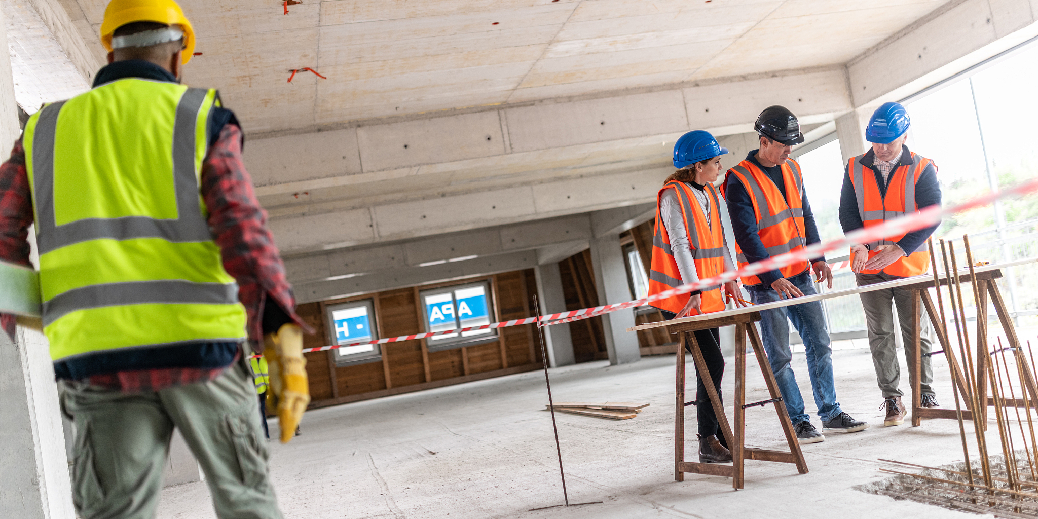 construction workers looking at blueprints