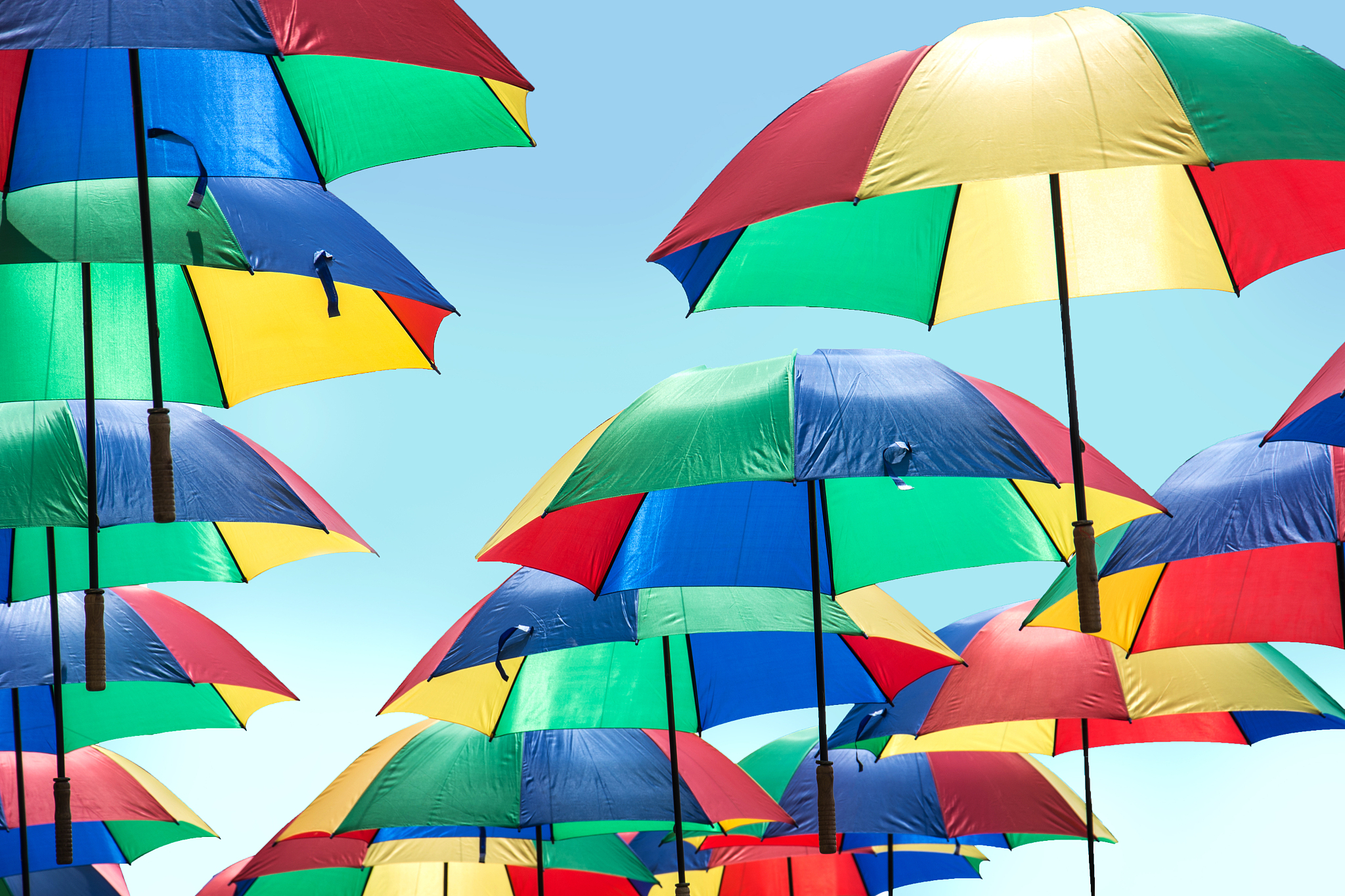 colorful umbrellas against clear sky