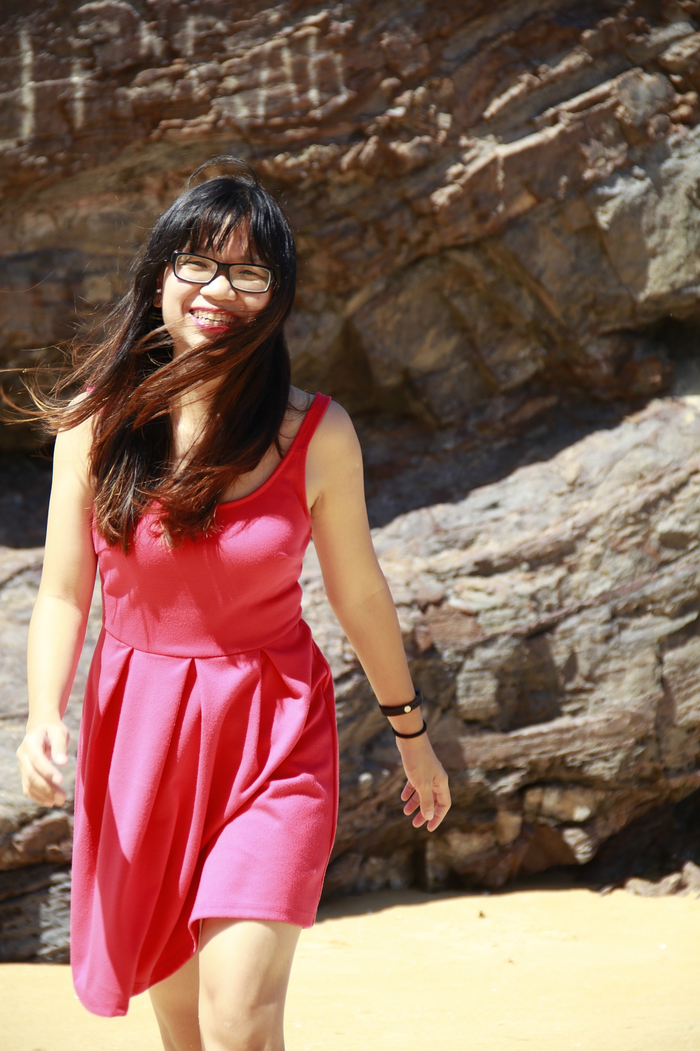 woman wearing eyeglasses standing on beach